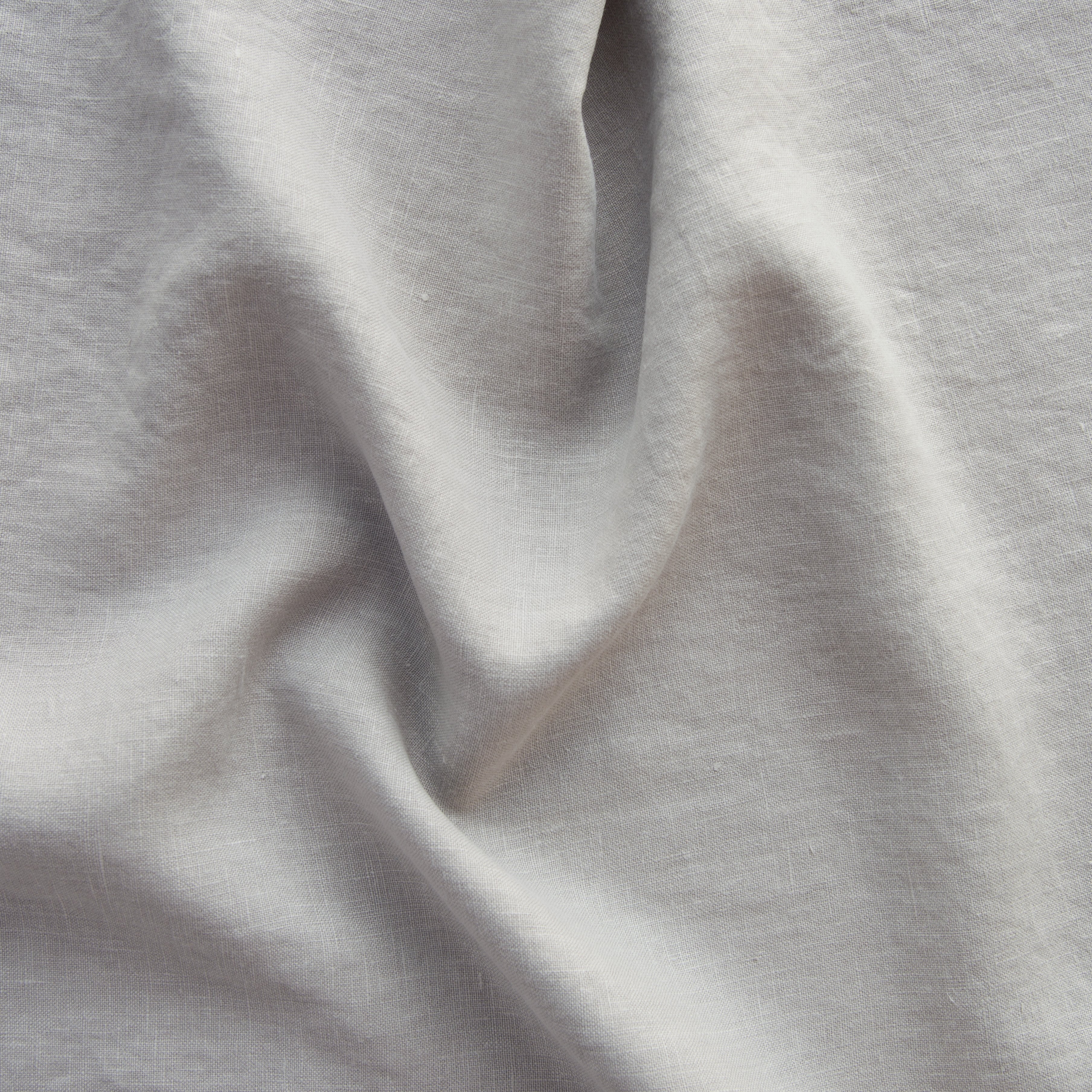 Fog: A close up of midweight linen in fog, a neutral-warm, soft mid-tone grey.