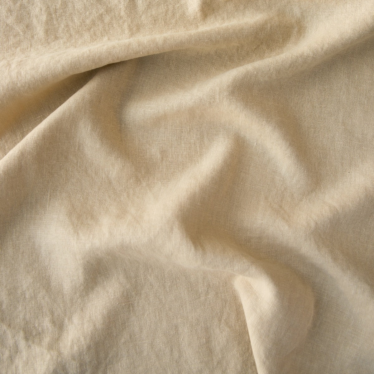 Honeycomb: A close up of midweight linen in honeycomb, a warm golden tone.