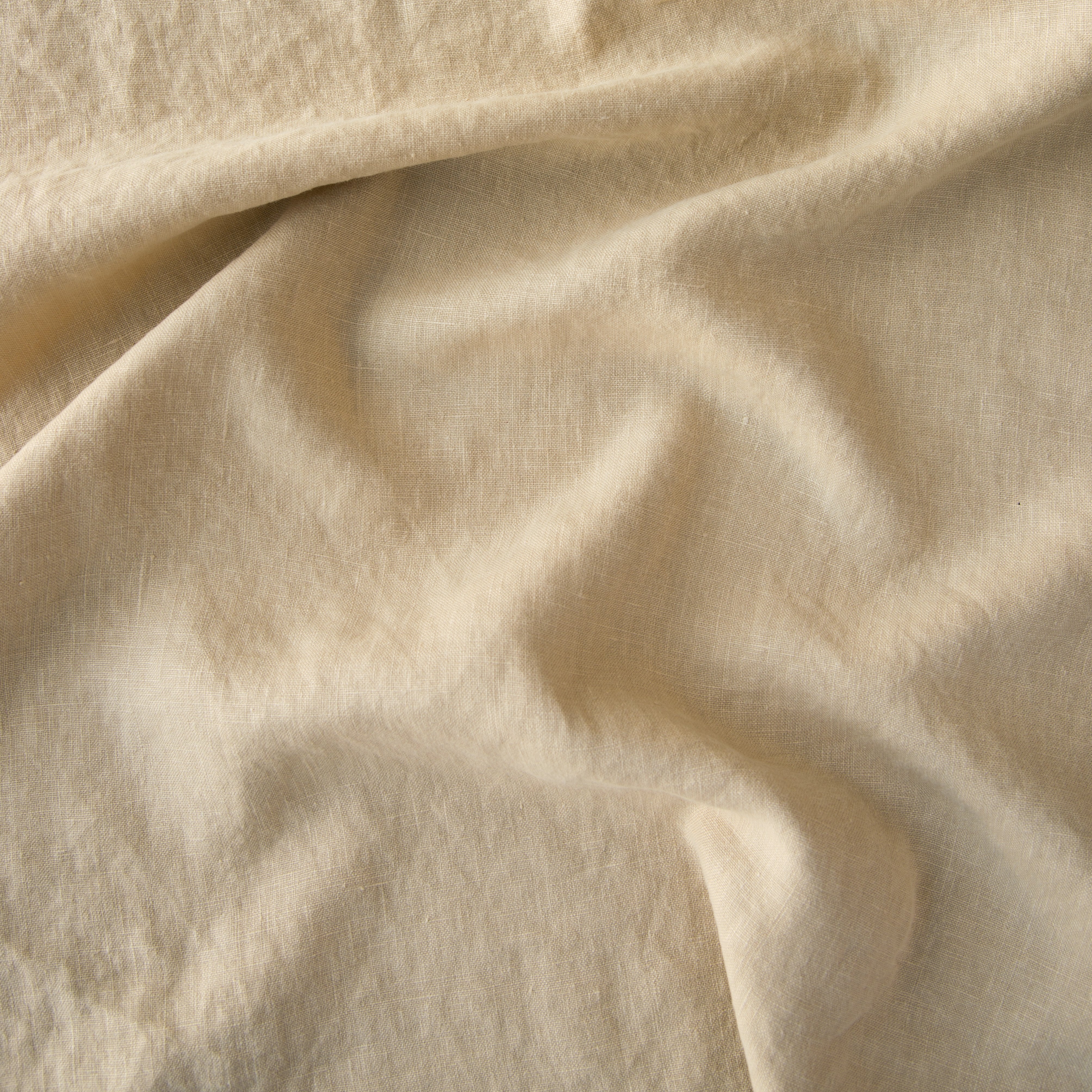 Honeycomb: A close up of midweight linen in honeycomb, a warm golden tone.