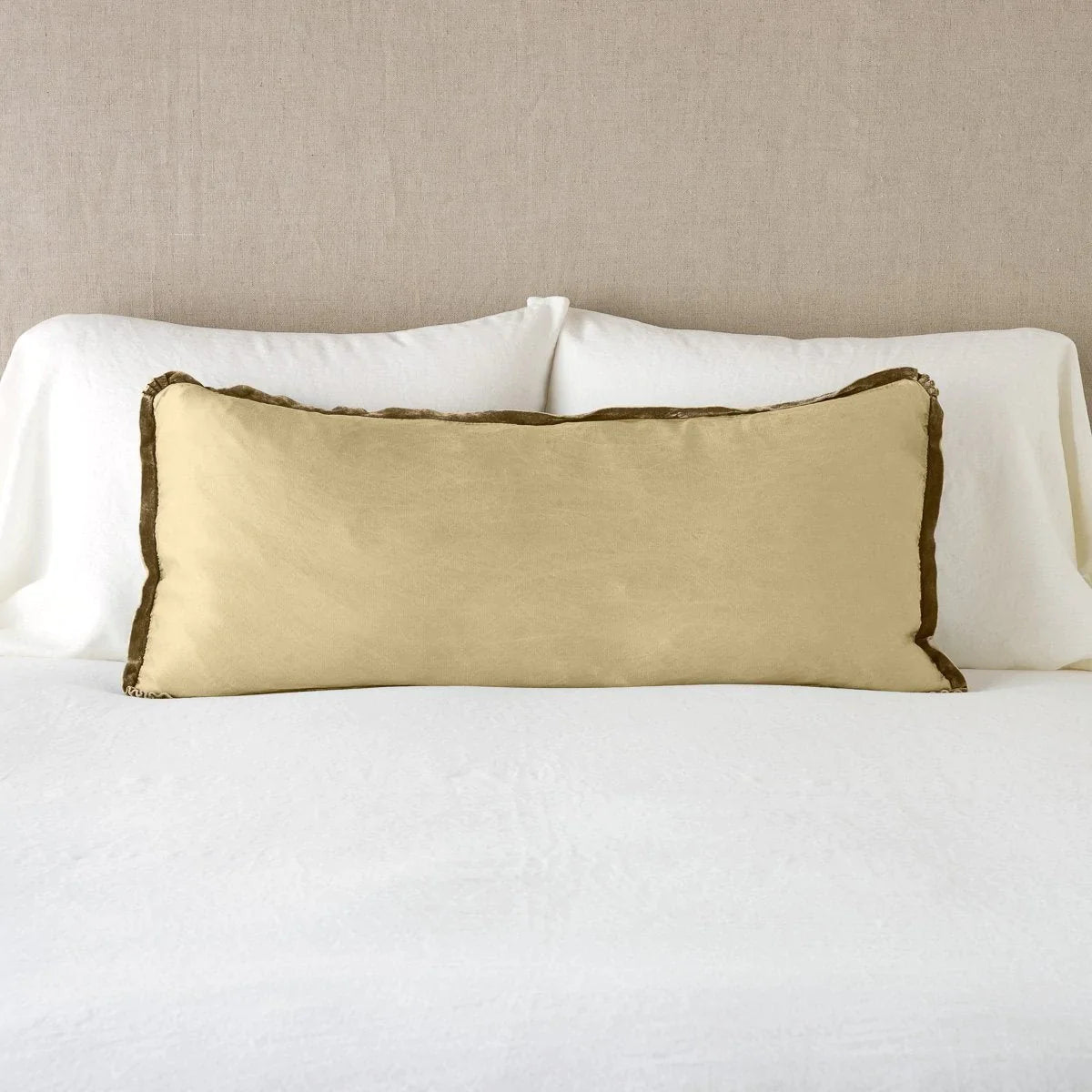Honeycomb: 16x36 charmeuse pllow wth silk velvet trim against white sleeping pillows and sheets — straight on with neutral background.