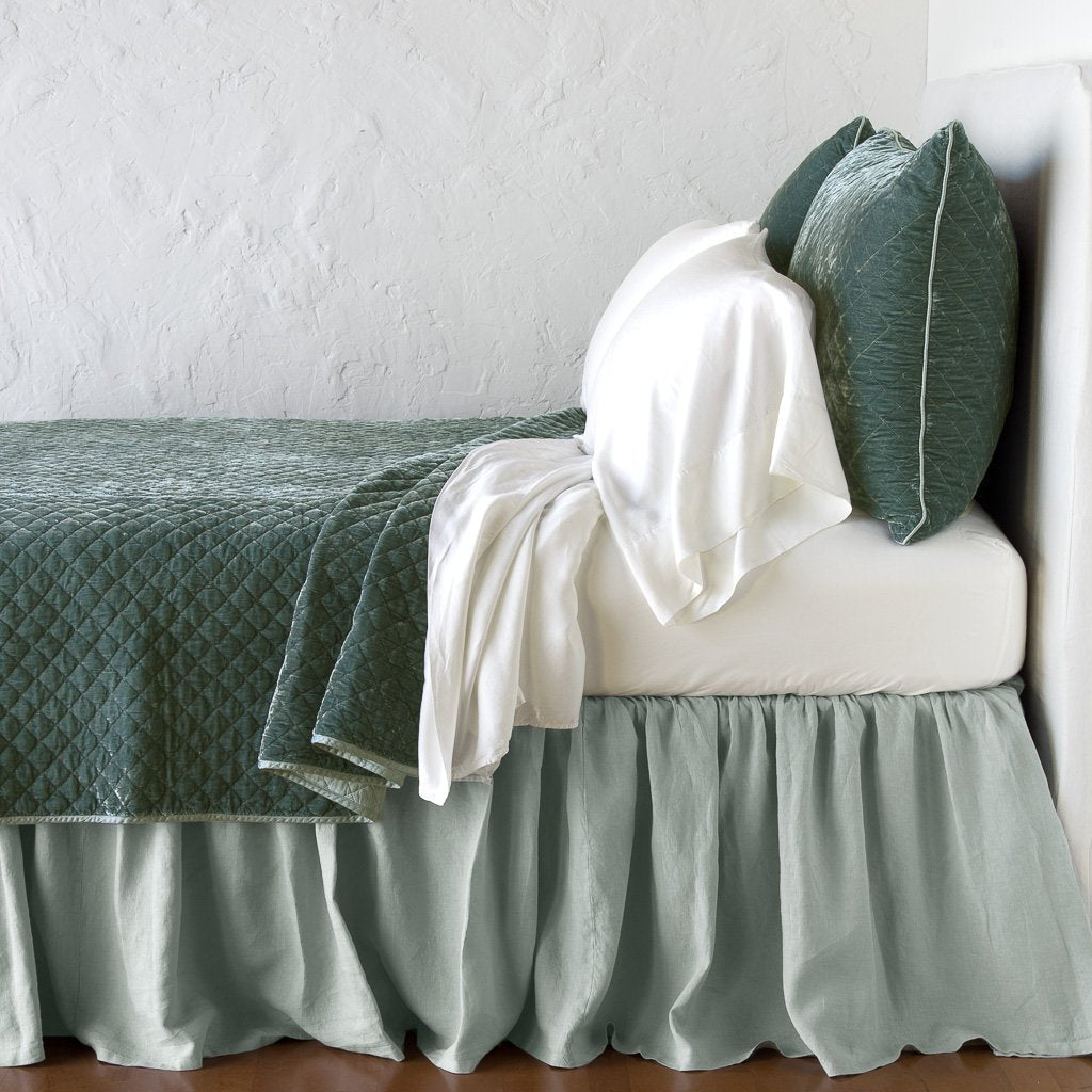 Eucalyptus: coverlet with matching shams and white sheeting - side view.