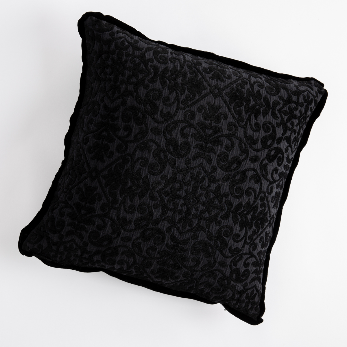 Corvino: cotton chenille jacquard 18x18 pillow shown from overhead to display the pillow's face and silk velvet trim β overhead against a white background.