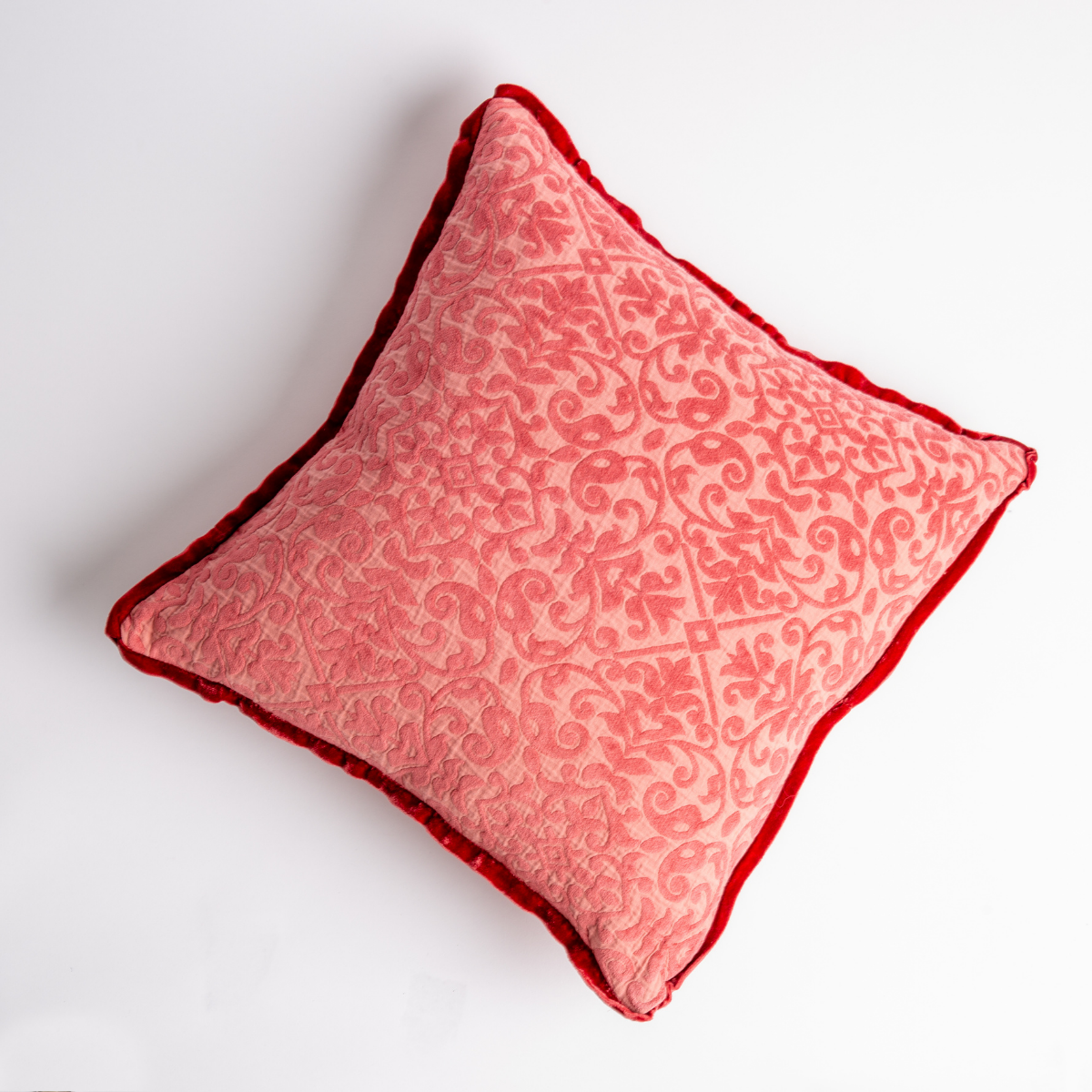 Poppy: cotton chenille jacquard 18x18 pillow shown from overhead to display the pillow's face and silk velvet trim β overhead against a white background.