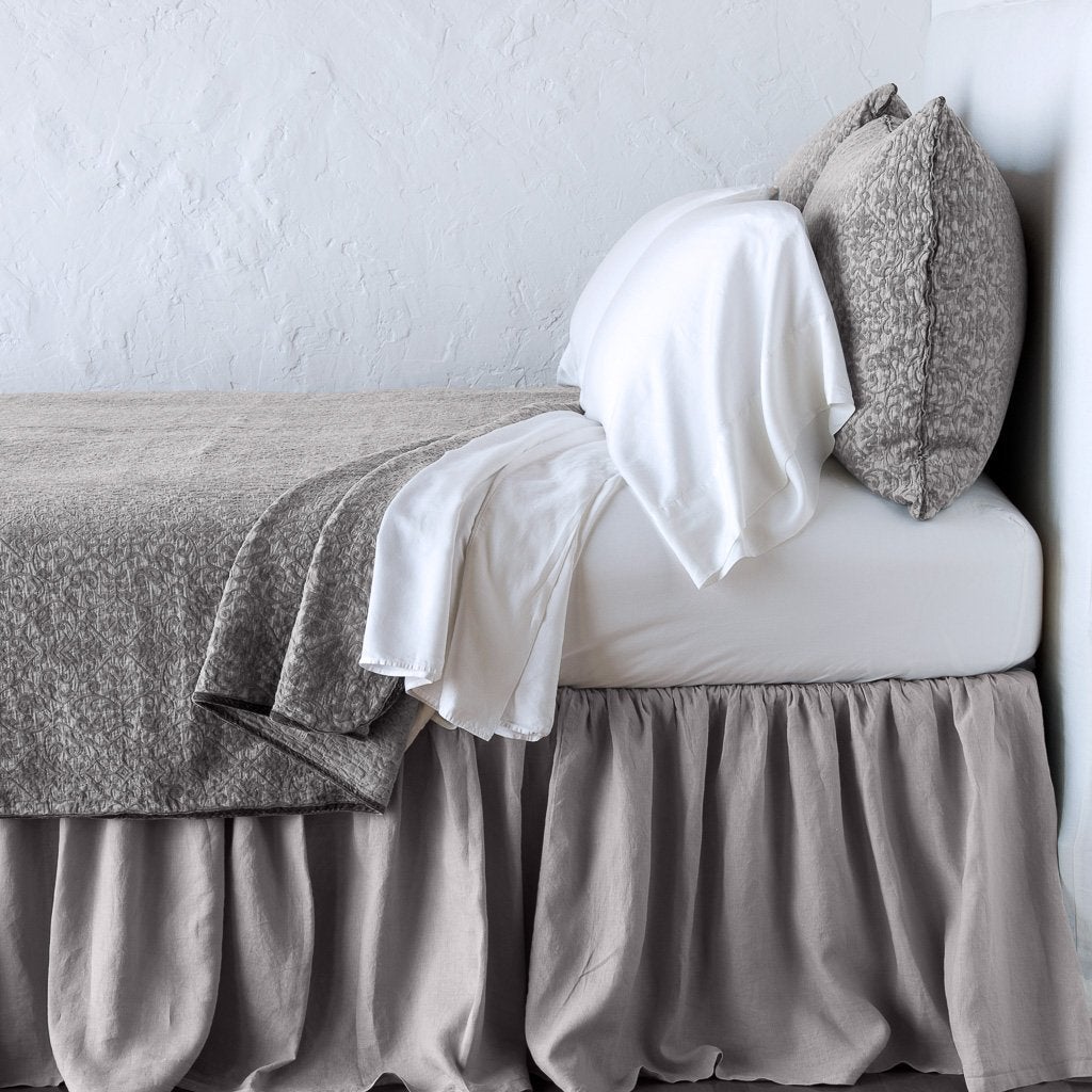 Fog: Cotton chenille jacquard coverlet and matching sham over white sheeting - side view.