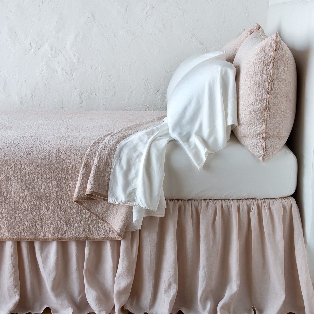 : Vienna coverlet and matching sham over white sheeting - pearl, side view.