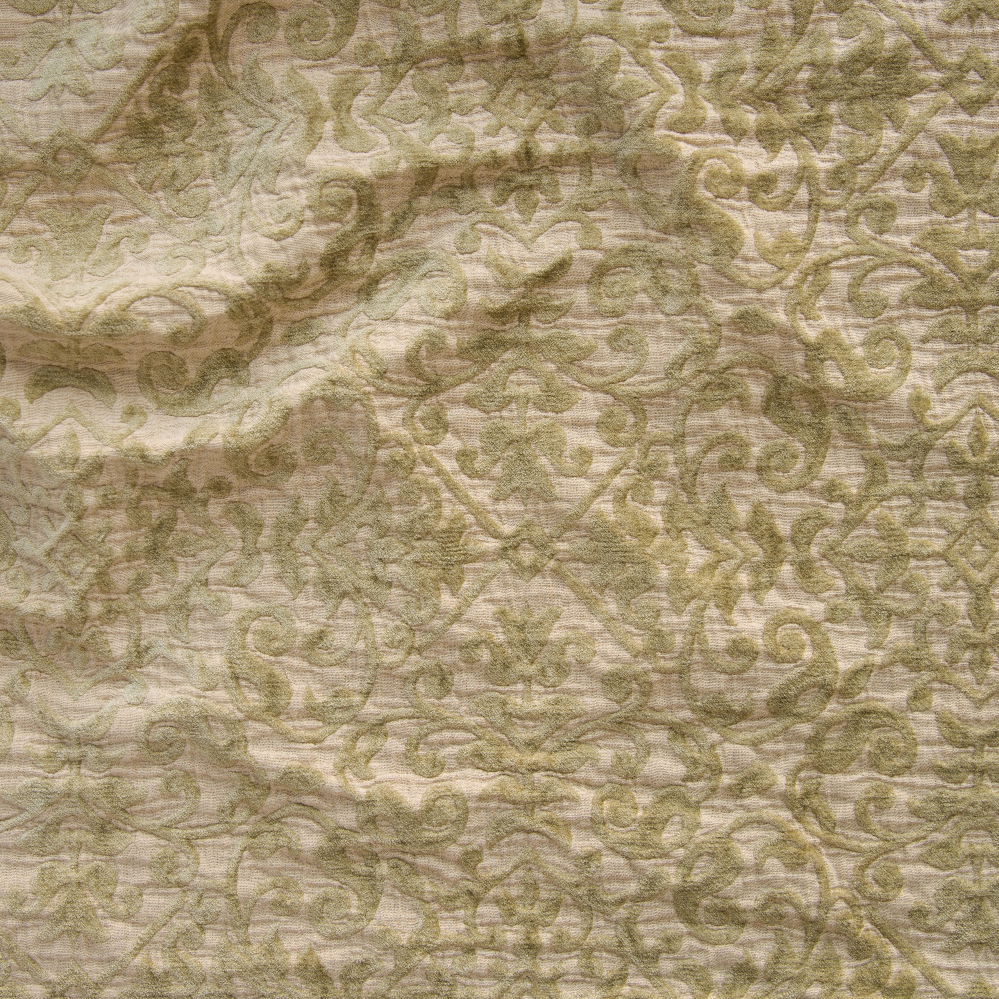 Honeycomb: A close up of Vienna cotton chenille jacquard in honeycomb, a warm golden tone.