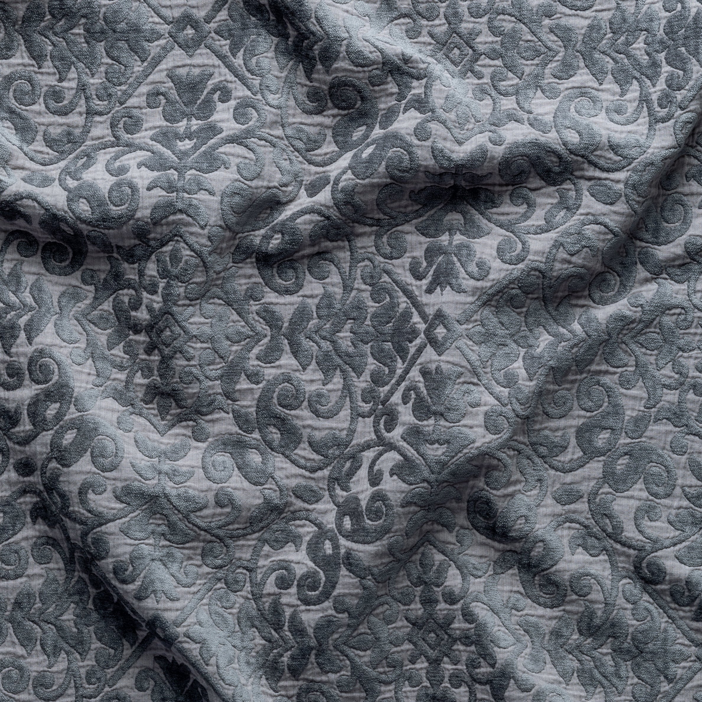 Moonlight: A close up of Vienna cotton chenille jacquard in moonlight, a saturated, cool, mid-dark grey tone.