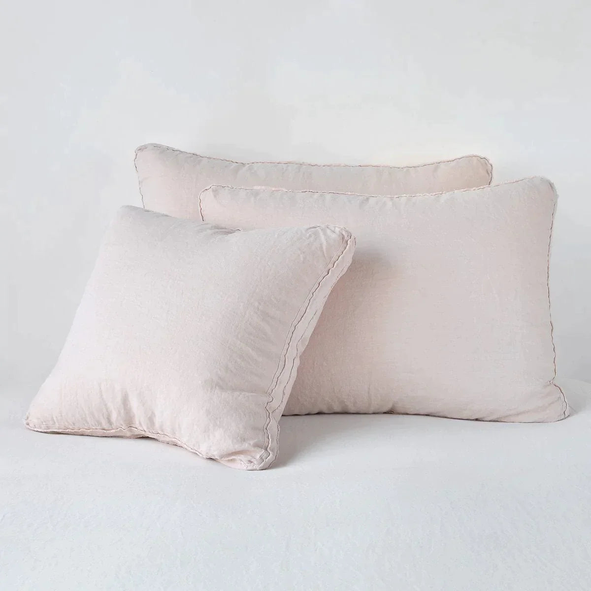 Pearl: Midweight linen shams in pearl colorway shown leaning upright on white background.
