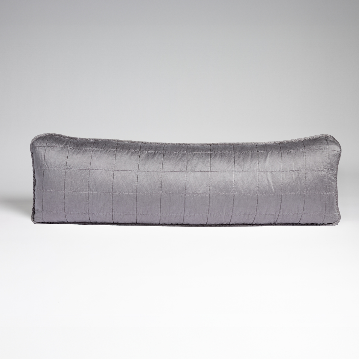French Lavender: A straight-on shot of a square-quilted body pillow in french lavender, a neutral violet tone, against a white background. 