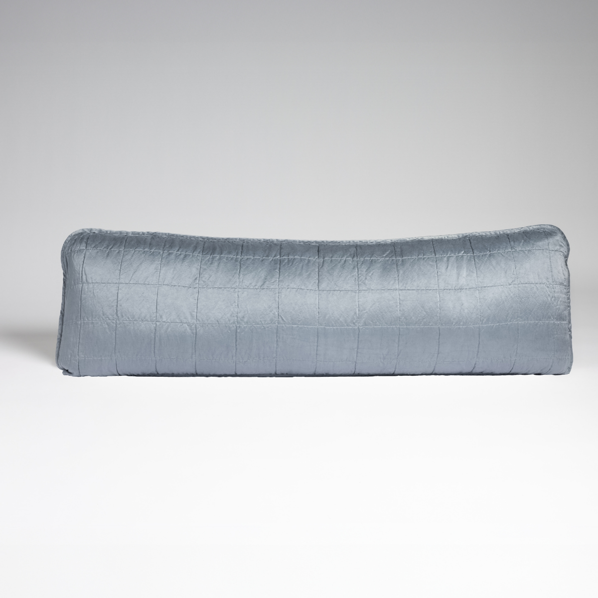 Tahoe Blue: A straight-on shot of a square-quilted body pillow in tahoe blue, a crisp true blue, against a white background. 