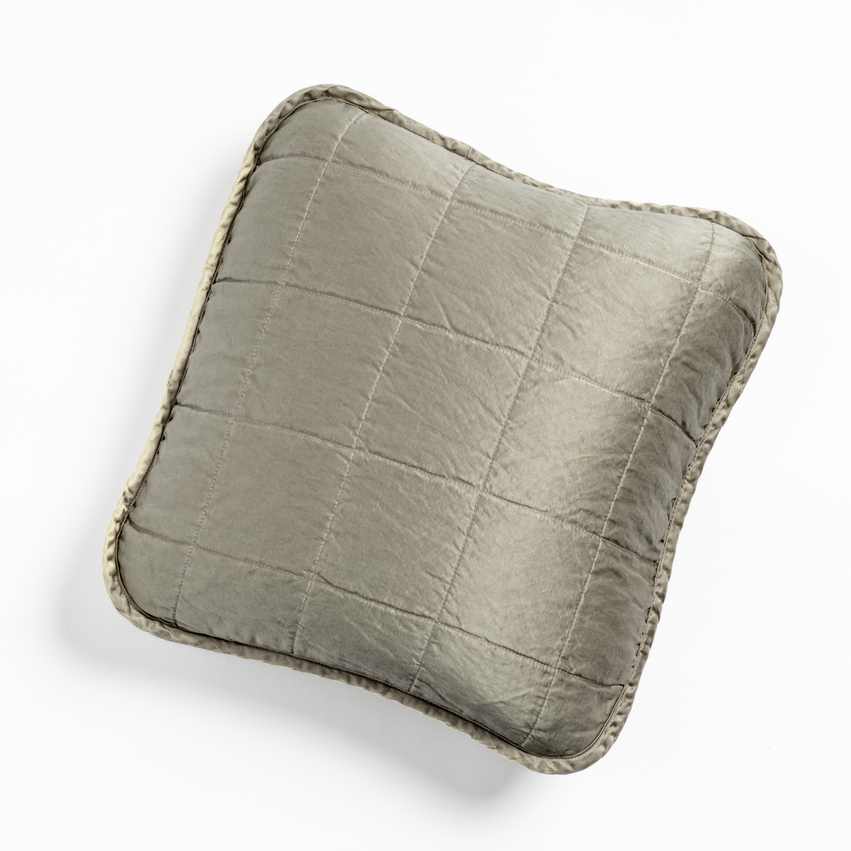 Fog: An overhead shot of a square-quilted square throw pillow in fog, a soft mid-tone grey against a white background. 