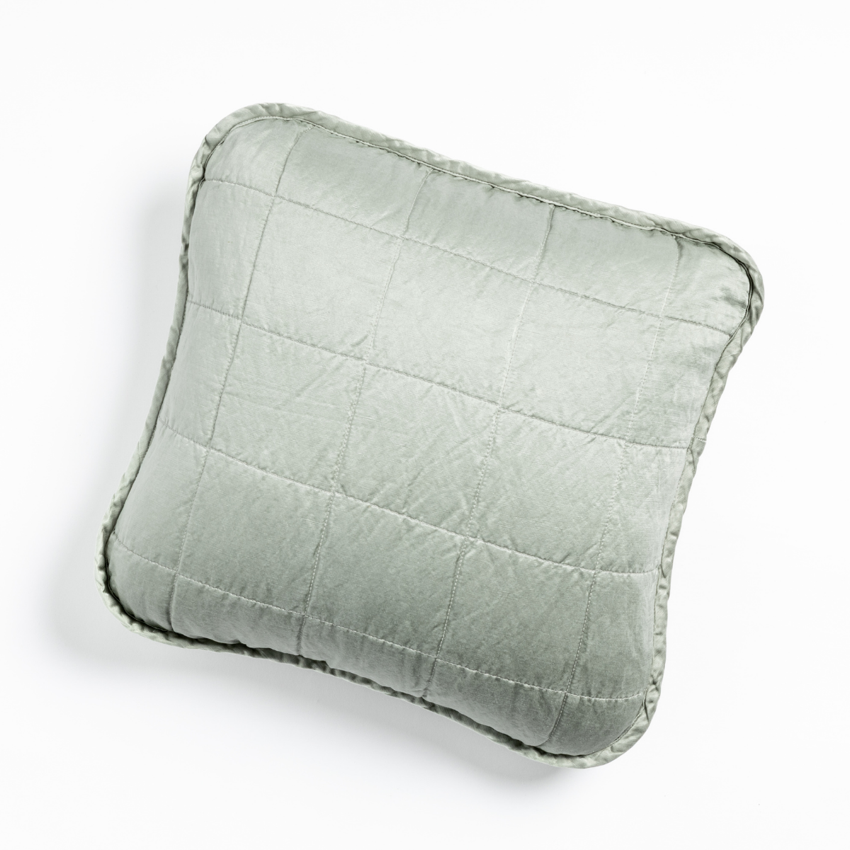 Mineral: An overhead shot of a square-quilted square throw pillow in mineral, a soothing seafoam blue with subtle grey-green undertones, against a white background. 