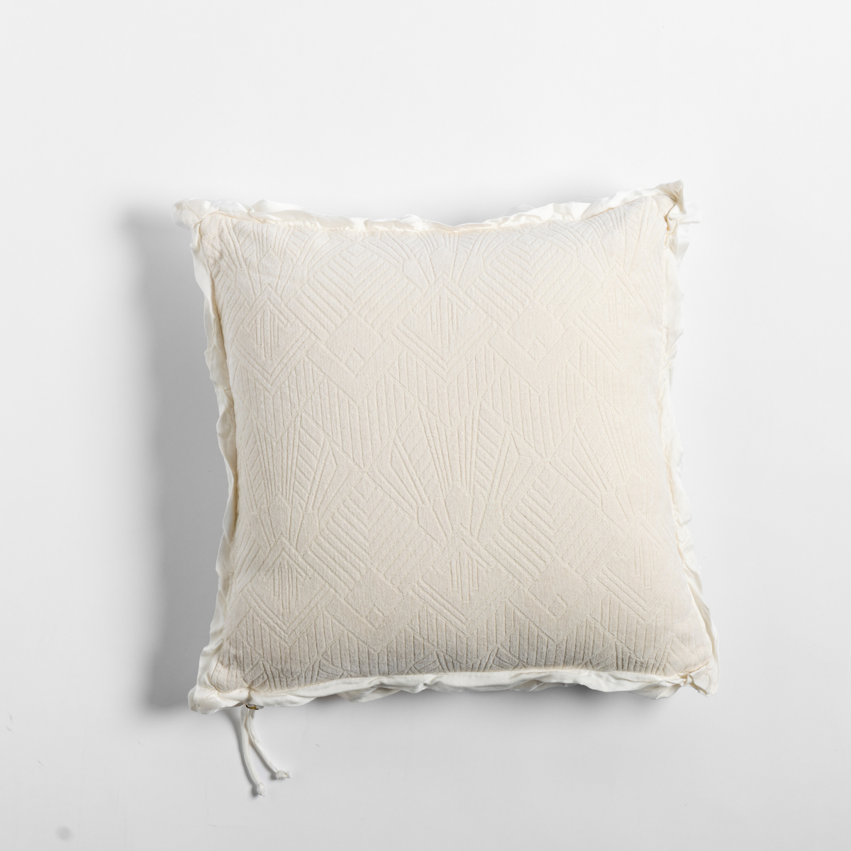 Natural: The chenille side of a textured throw pillow with contrasting ruffled edges, shot from overhead against a plain background.
