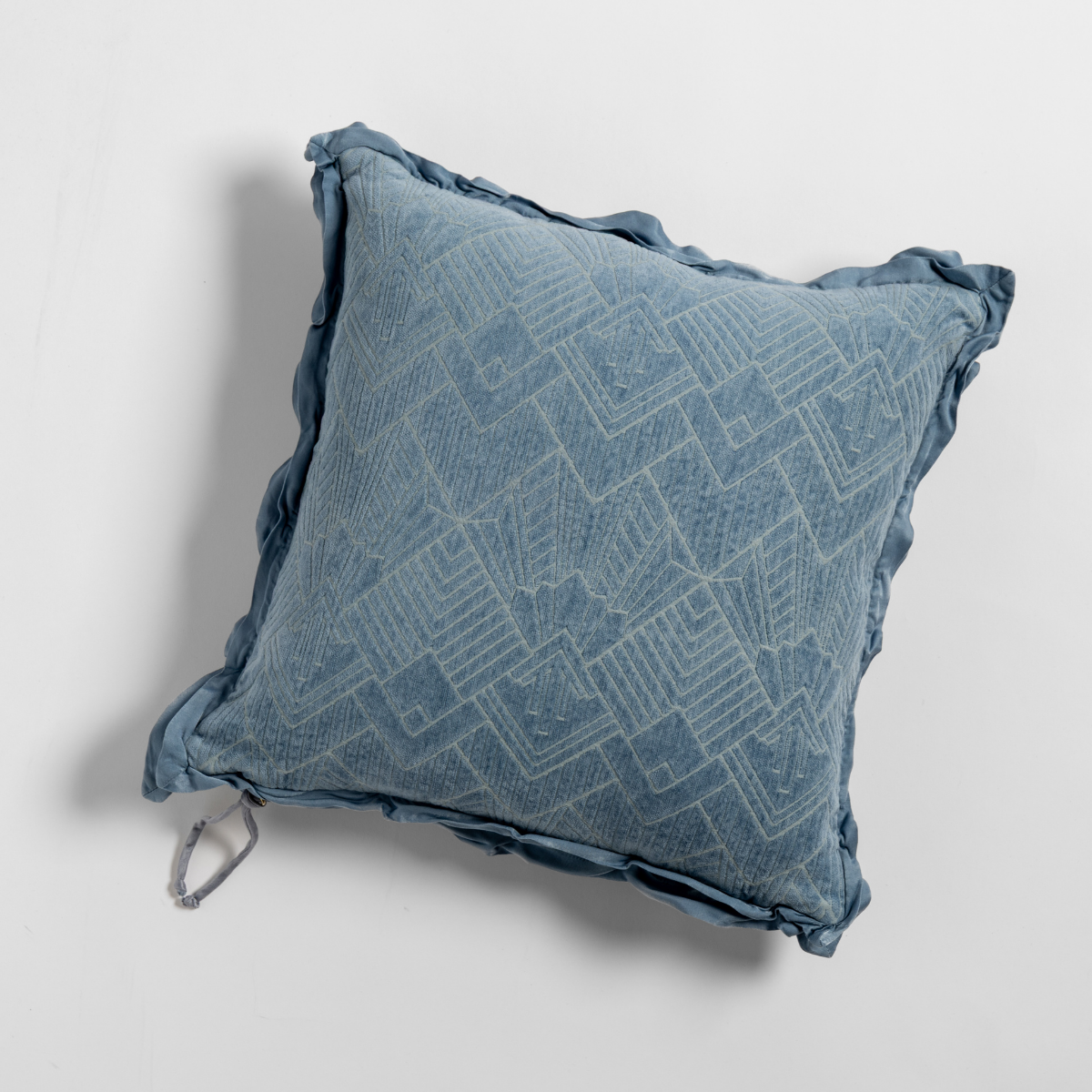 Tahoe Blue: The chenille side of a textured throw pillow with contrasting ruffled edges, shot from overhead against a plain background.