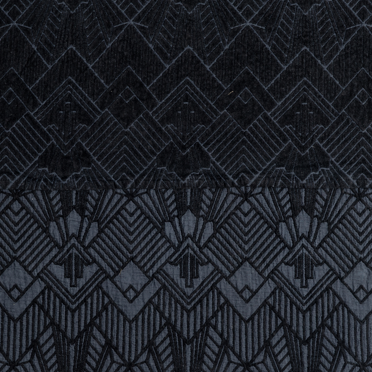 Corvino: a close-up showing the chenille jacquard on the top half and cotton jacquard on the bottom in corvino, a classic black
