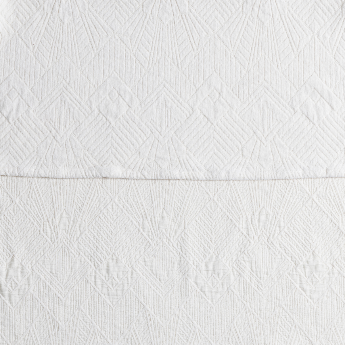 Winter White: a close-up showing the chenille jacquard on the top half and cotton jacquard on the bottom in winter white, a wooly white. 