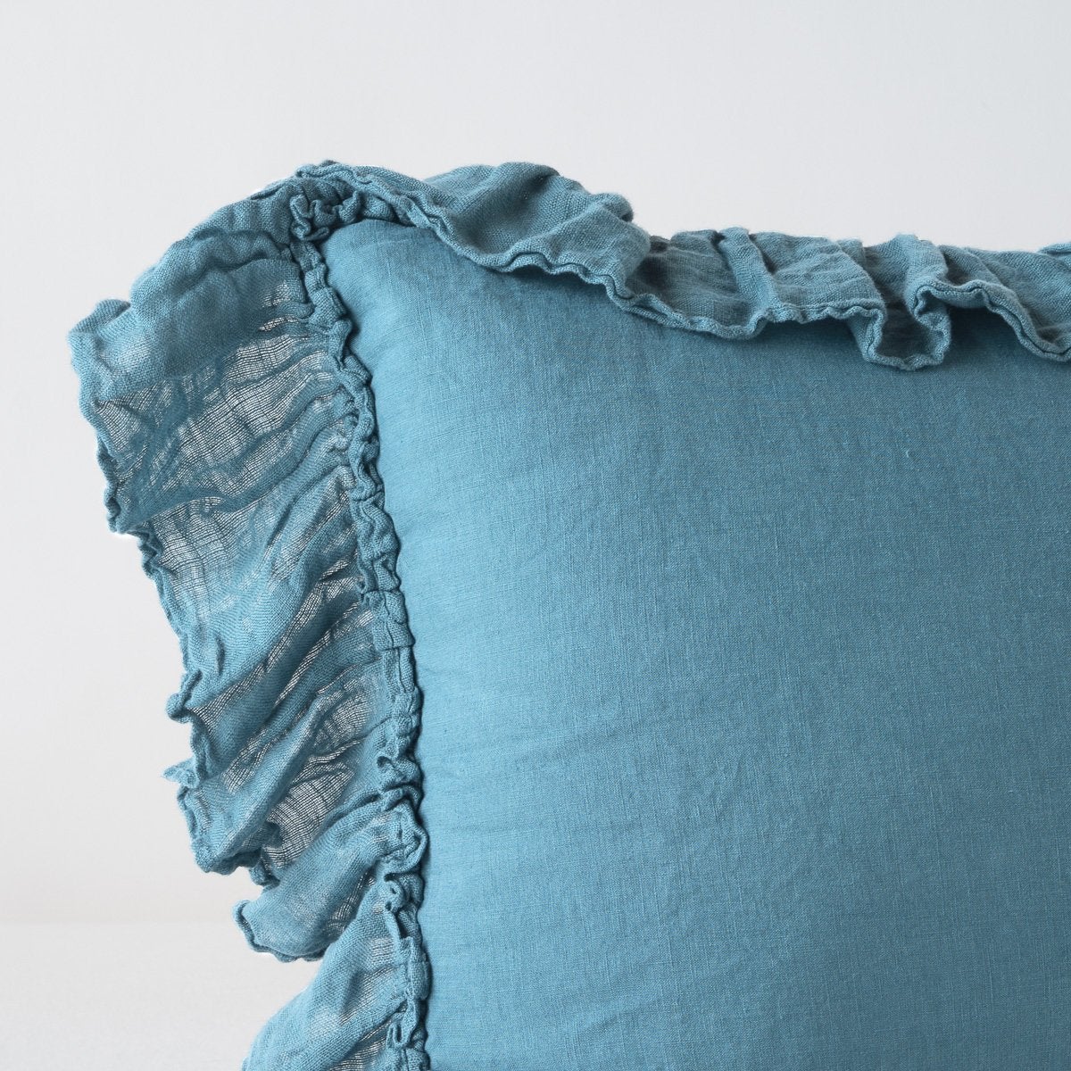[allvariants]: Corner detail close-up of Linen Whisper sham, showcasing slight translucence of ruffle trim detail - cenote.