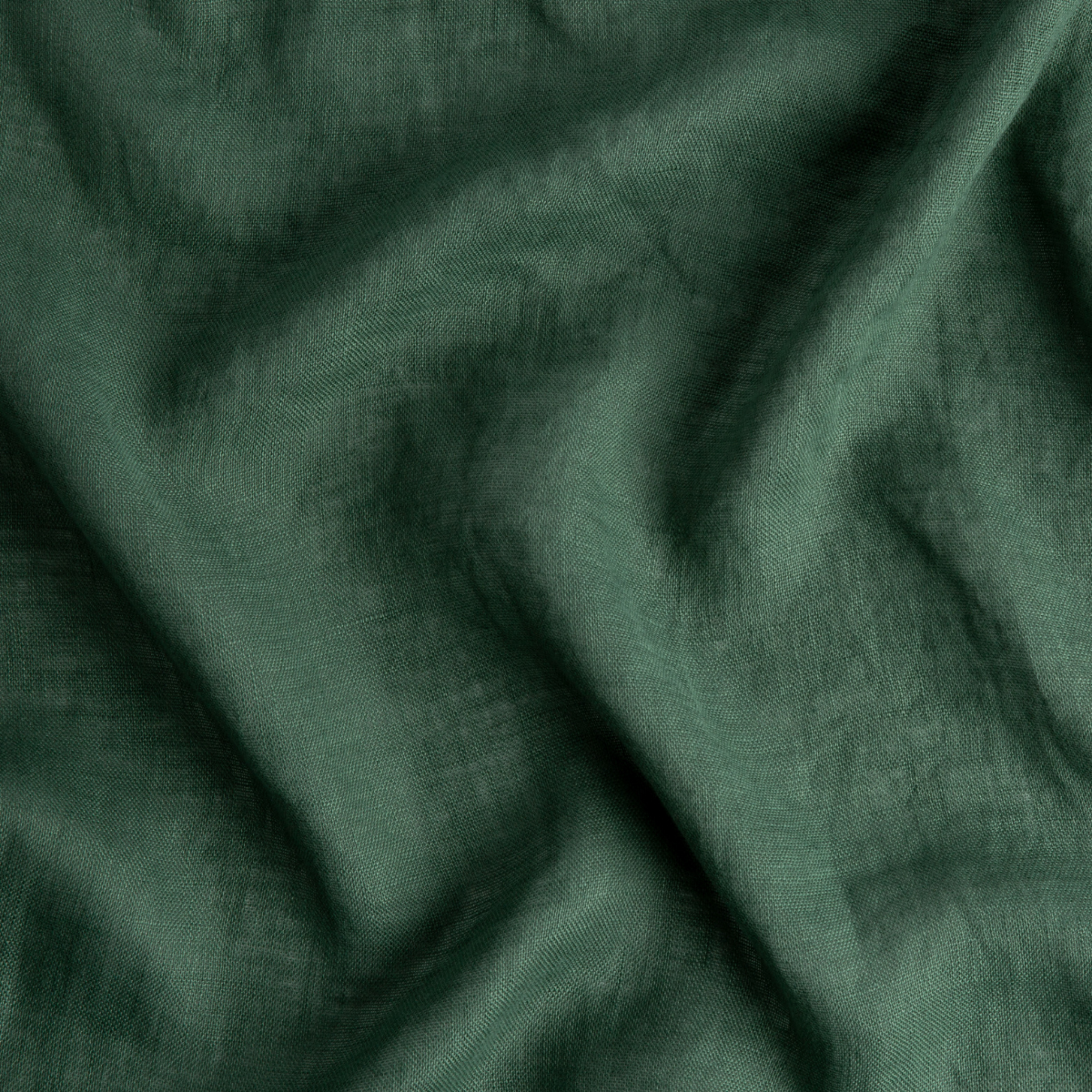 A close up of linen whisper, our lightweight linen gauze, in jade, a rich, verdant green with subtle blue undertones.