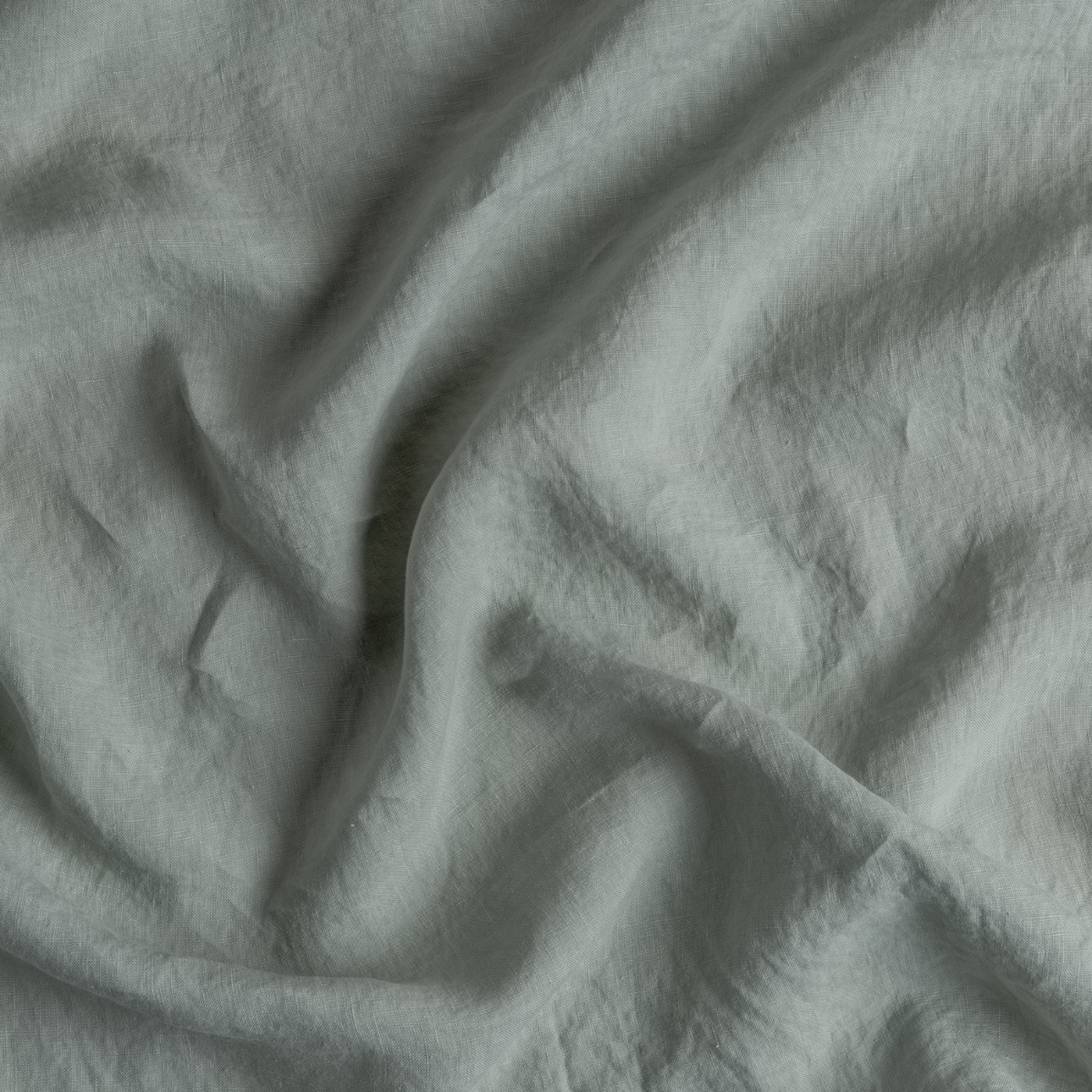 Eucalyptus: A close up of linen fabric in eucalyptus, a soft light green.