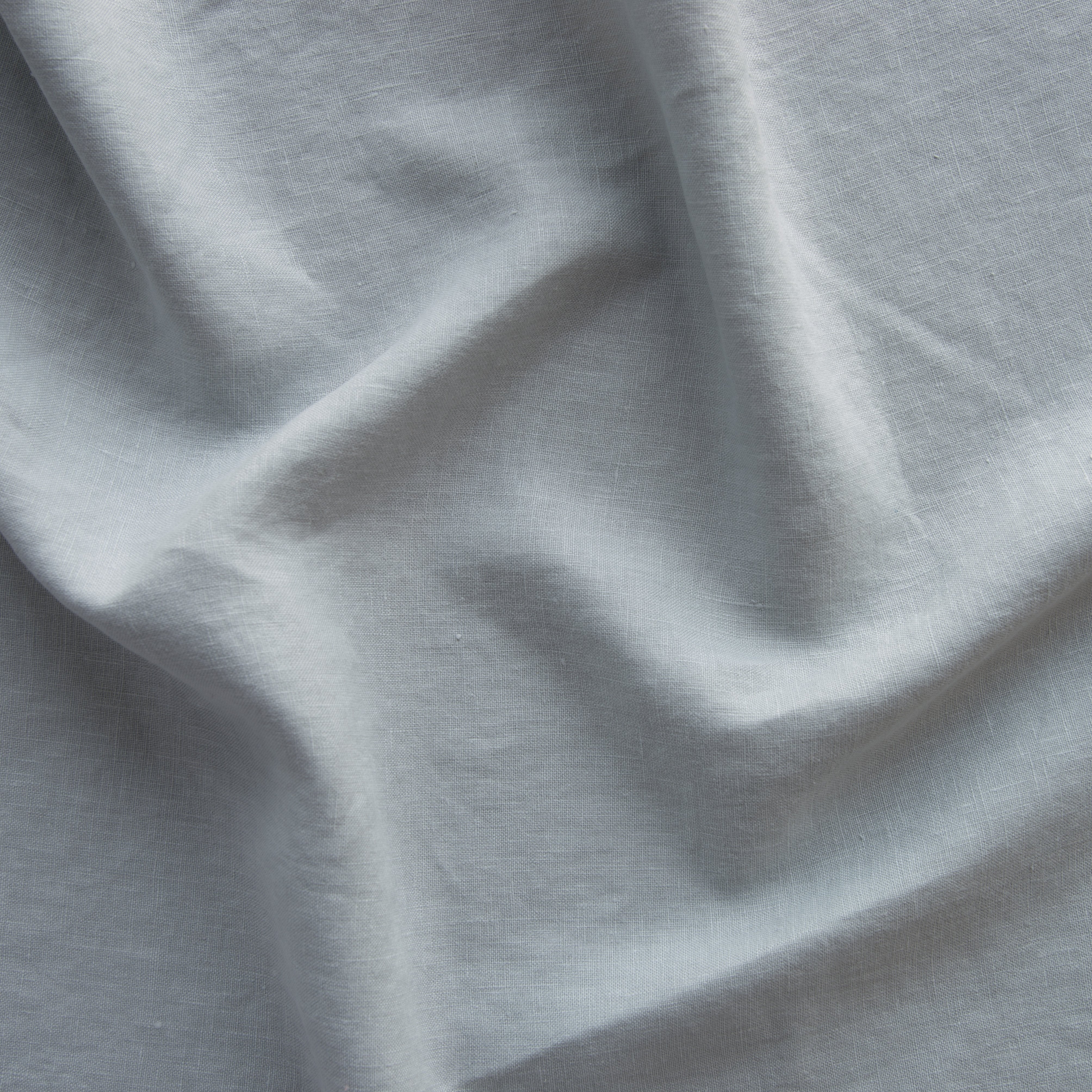 Mineral: A close up of linen in mineral, a soothing seafoam blue with subtle grey-green undertones. 