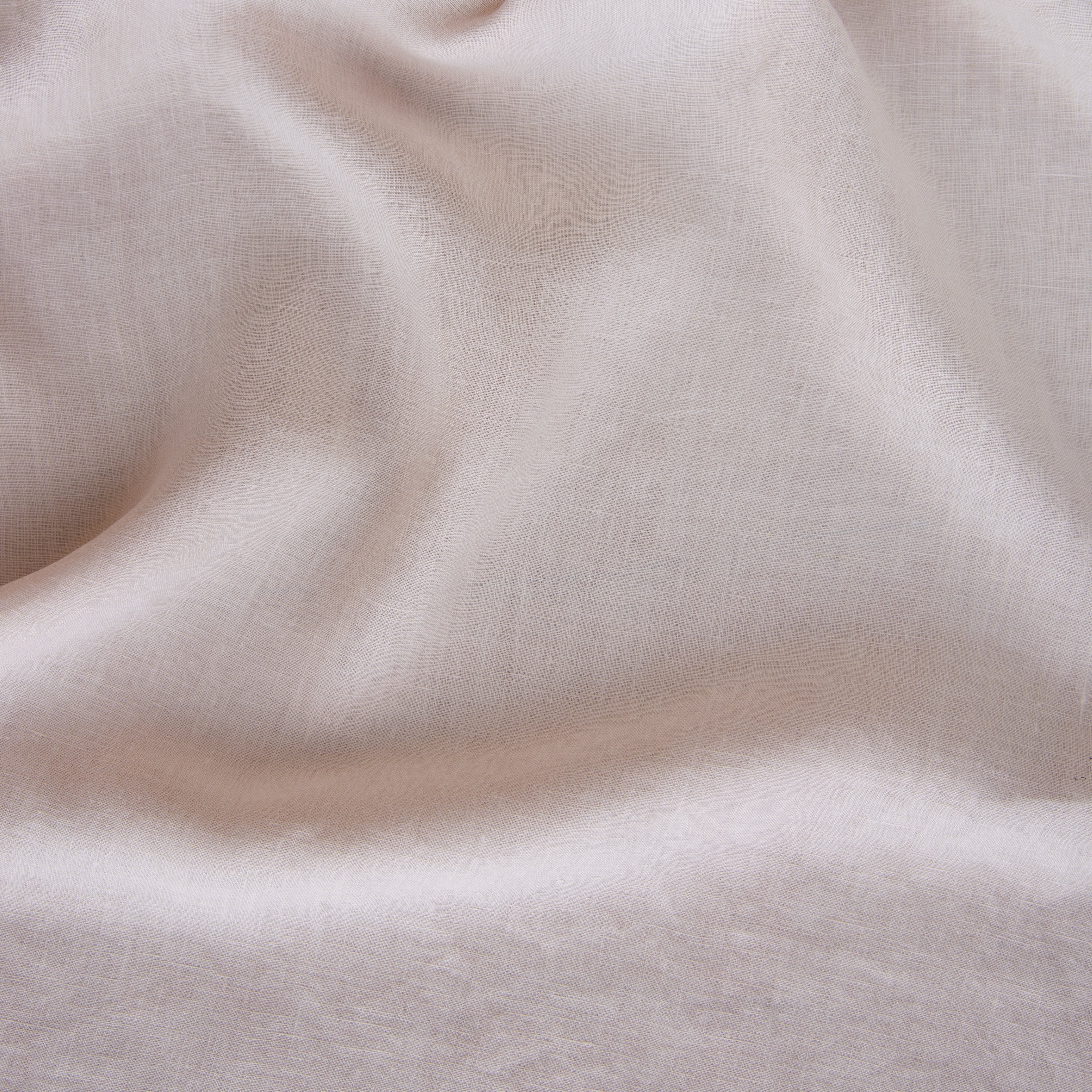 Pearl: A close up of linen in pearl, a nude-like, soft rose pink tone. 