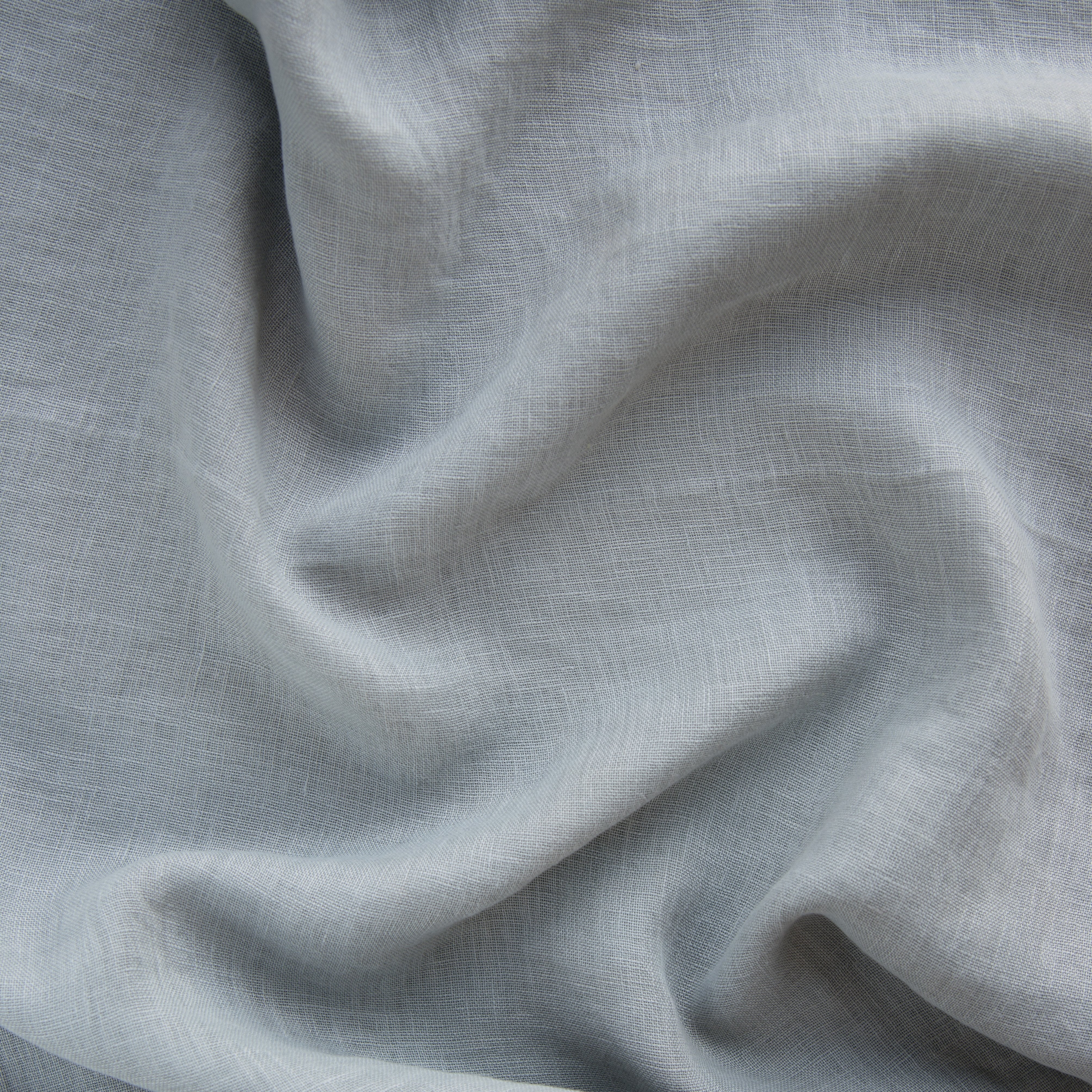 Mineral: A close up of linen whisper, our lightweight linen gauze, in mineral, a soothing seafoam blue with subtle grey-green undertones. 