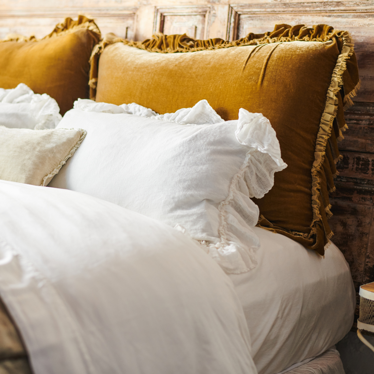 : Ruffle trim in three styles and textures layered together: Loulah silk velvet, Linen Whisper gauze, and Carmen silk velvet with petite charmeuse ruffle.