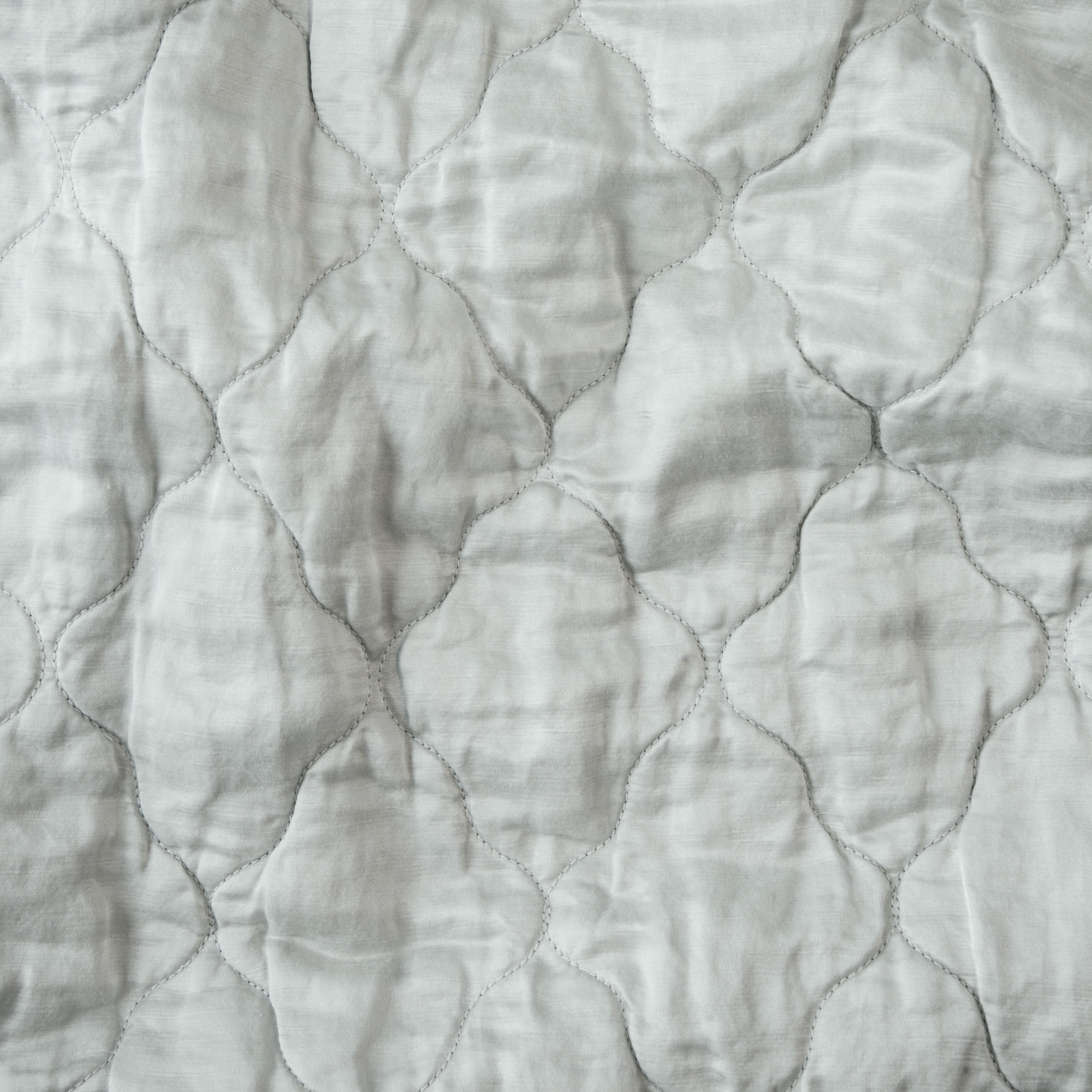 Cloud: Close-up of Luna silk charmeuse quilting in cloud, a soft, subtle sky blue-grey. 