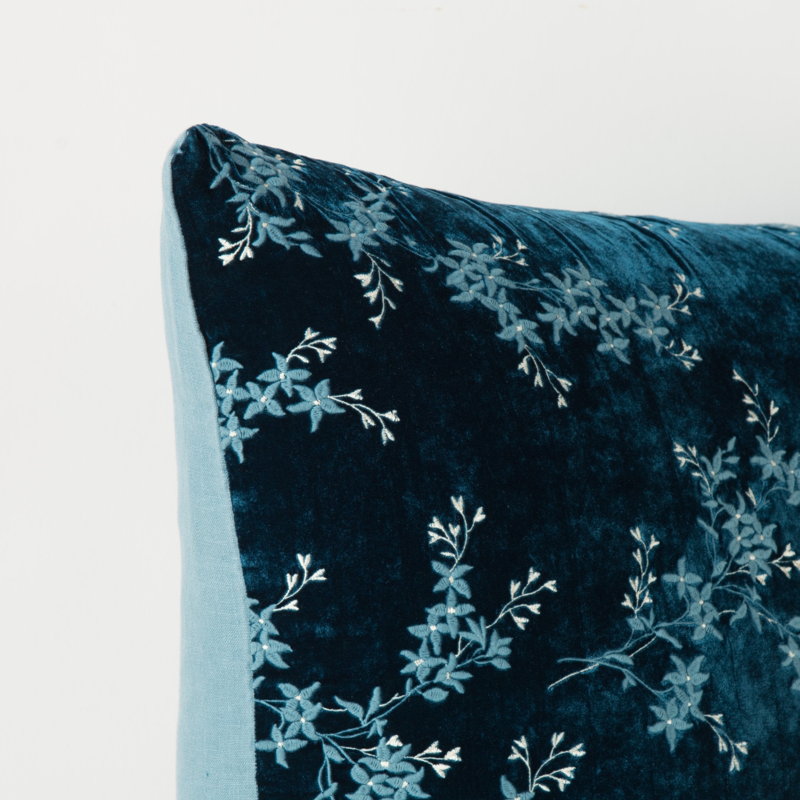 Cenote: Corner detail close-up, highlighting two-tone embroidery and linen back.