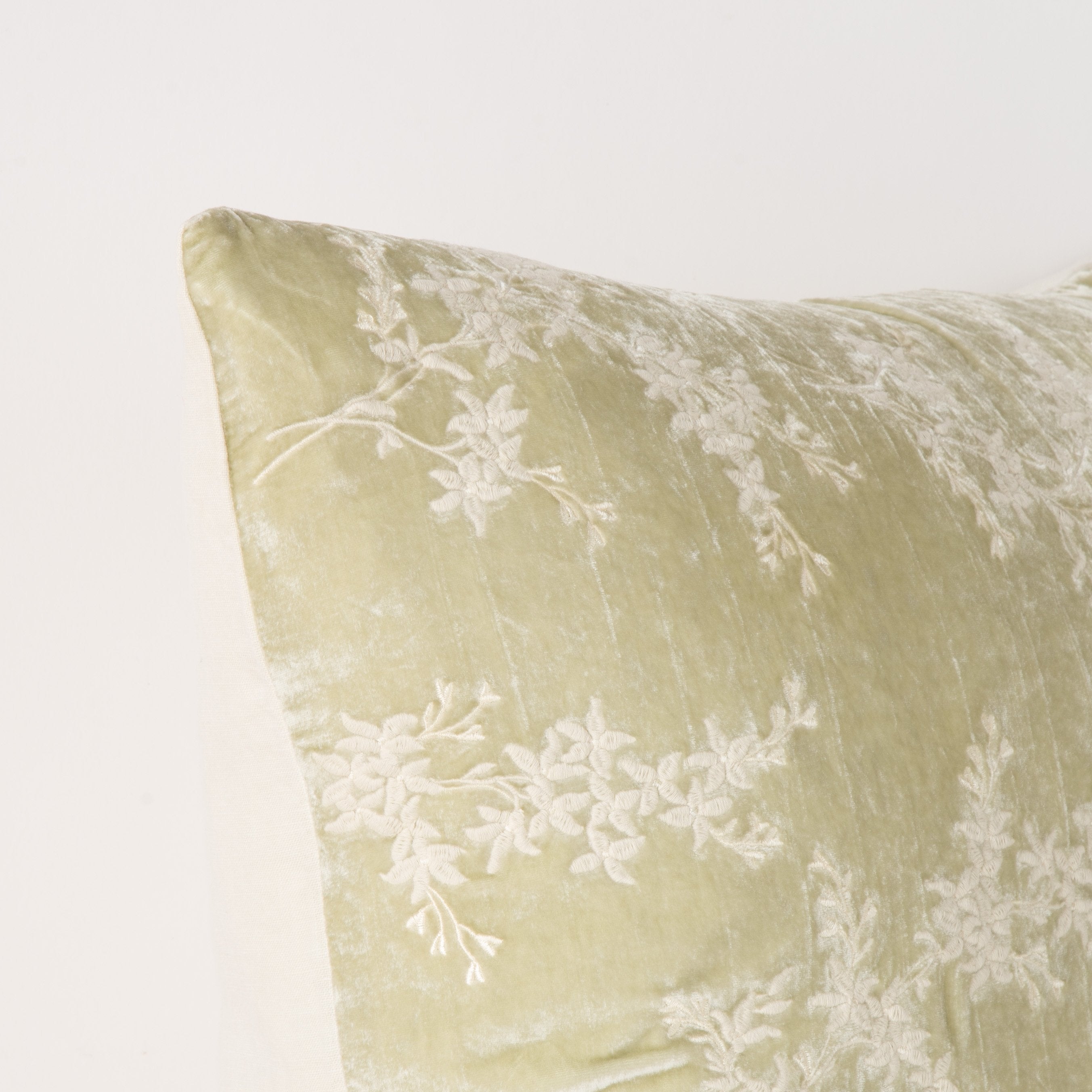 Parchment: Corner detail close-up, highlighting two-tone embroidery and linen back.