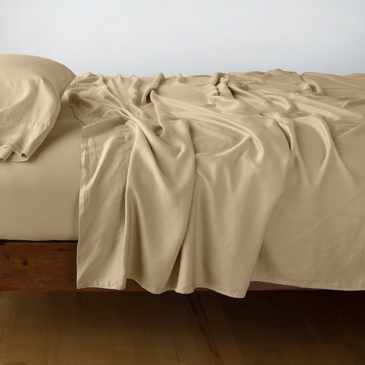 Honeycomb: sleeping pillow with matching rumpled sheeting - side view.