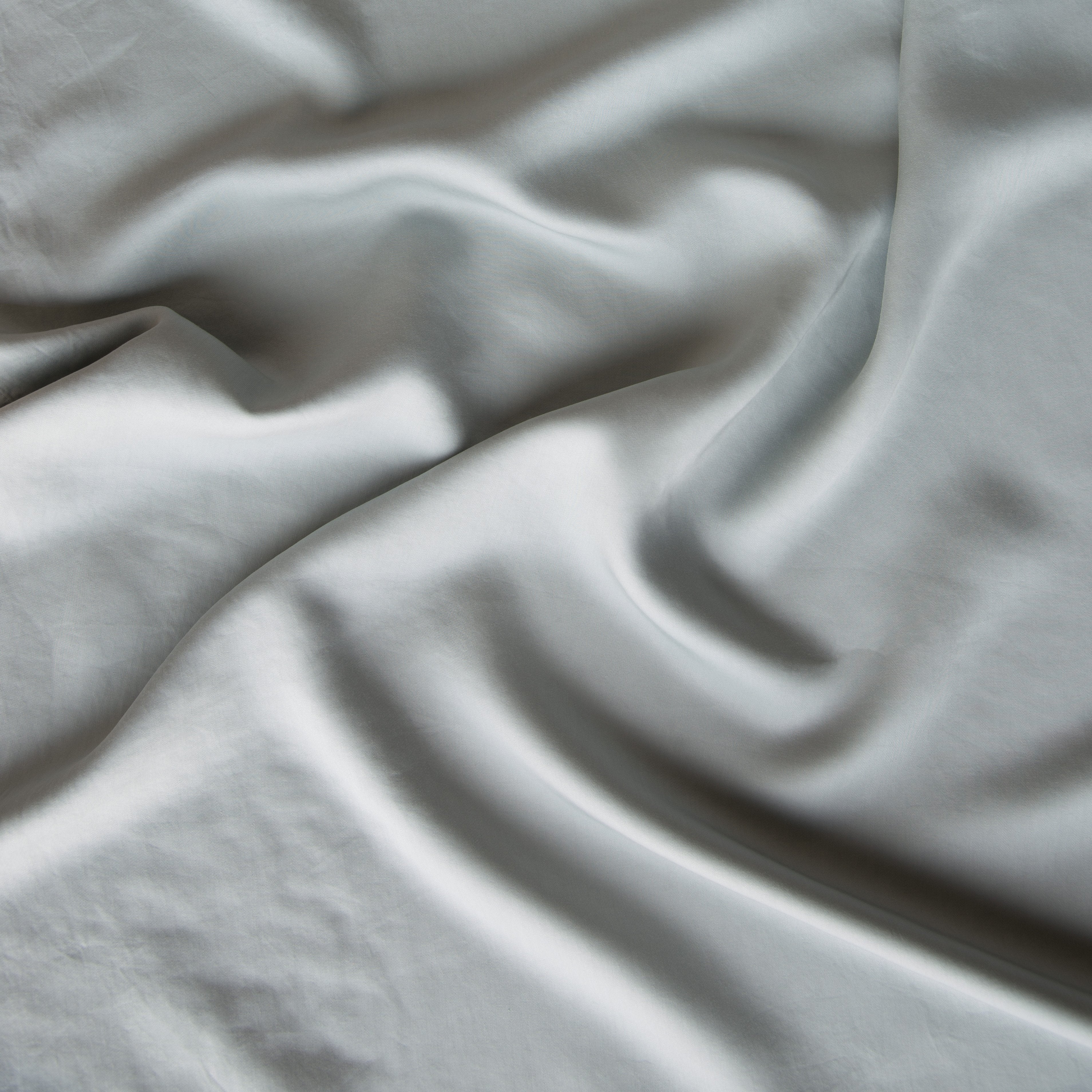 Mineral: A close up of Tencel™ in mineral, a soothing seafoam blue with subtle grey-green undertones. 