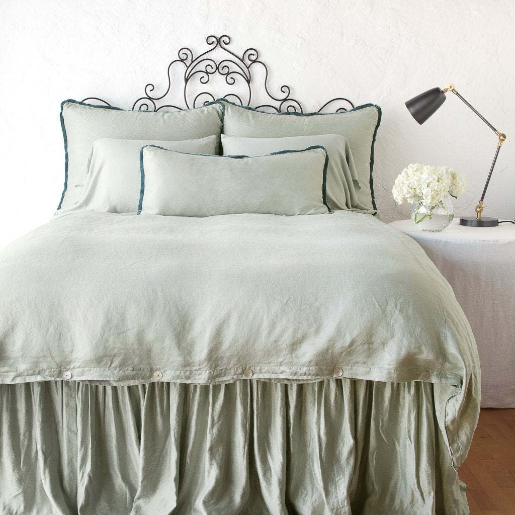 [allvariants]: Paloma duvet cover with matching pillows and bed skirt - eucalyptus, end of bed view.