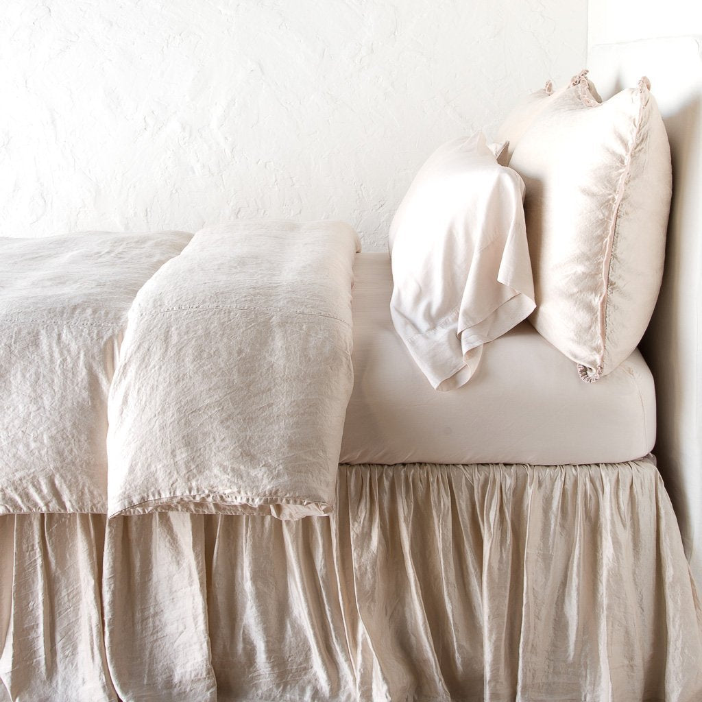 [allvariants]: Paloma duvet cover with matching pillows and bed skirt - pearl, side view.
