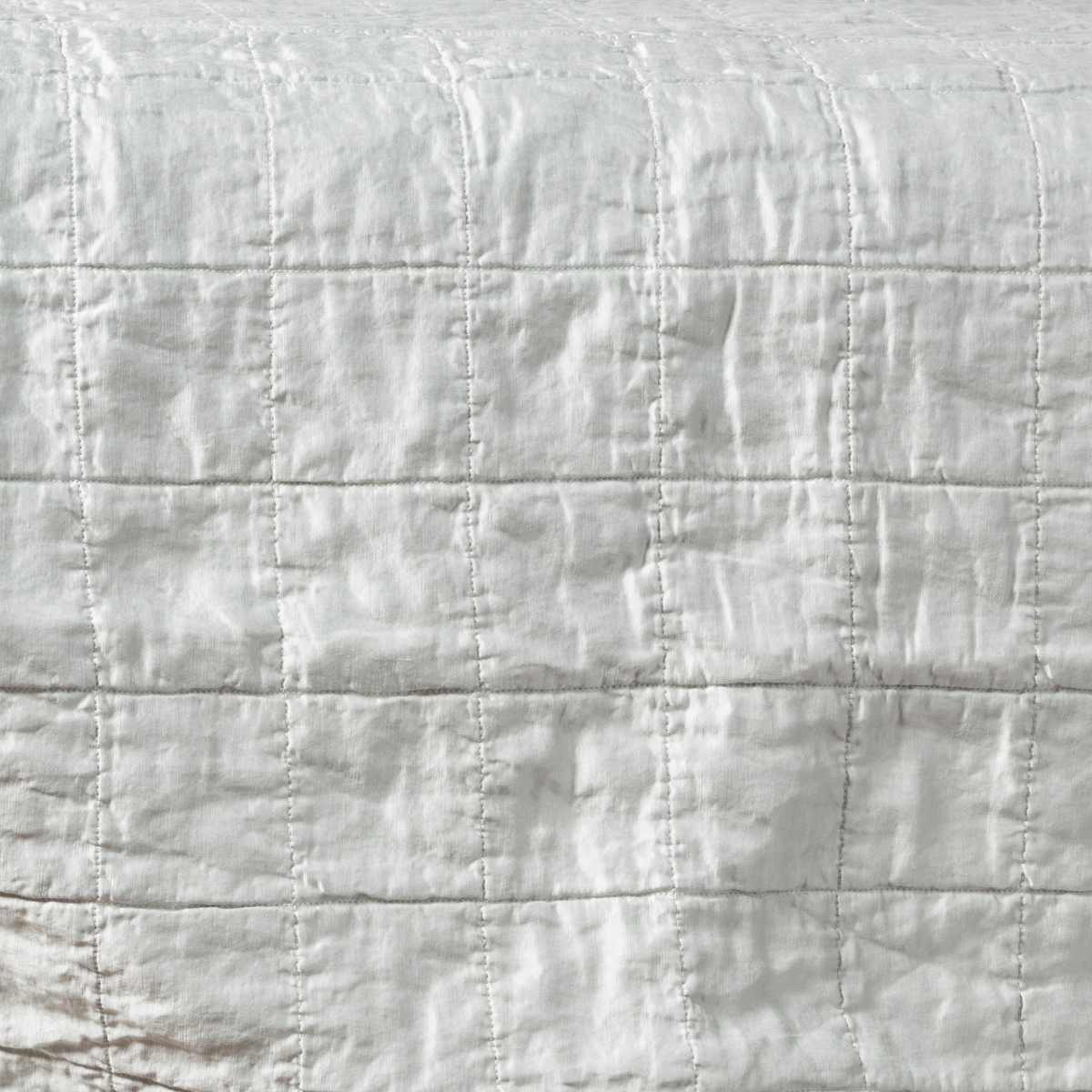 Cloud: a shot of square-quilted charmeuse in cloud, a subtle sky blue-grey.