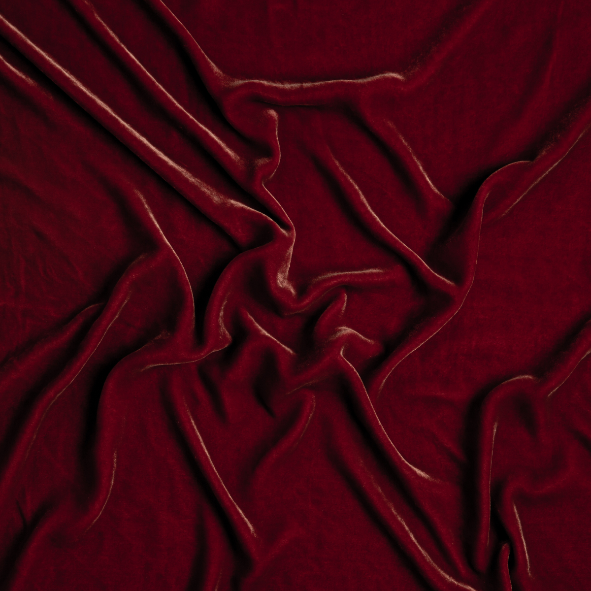 Poppy: A close up of silk velvet fabric in poppy, a warm coral pink.