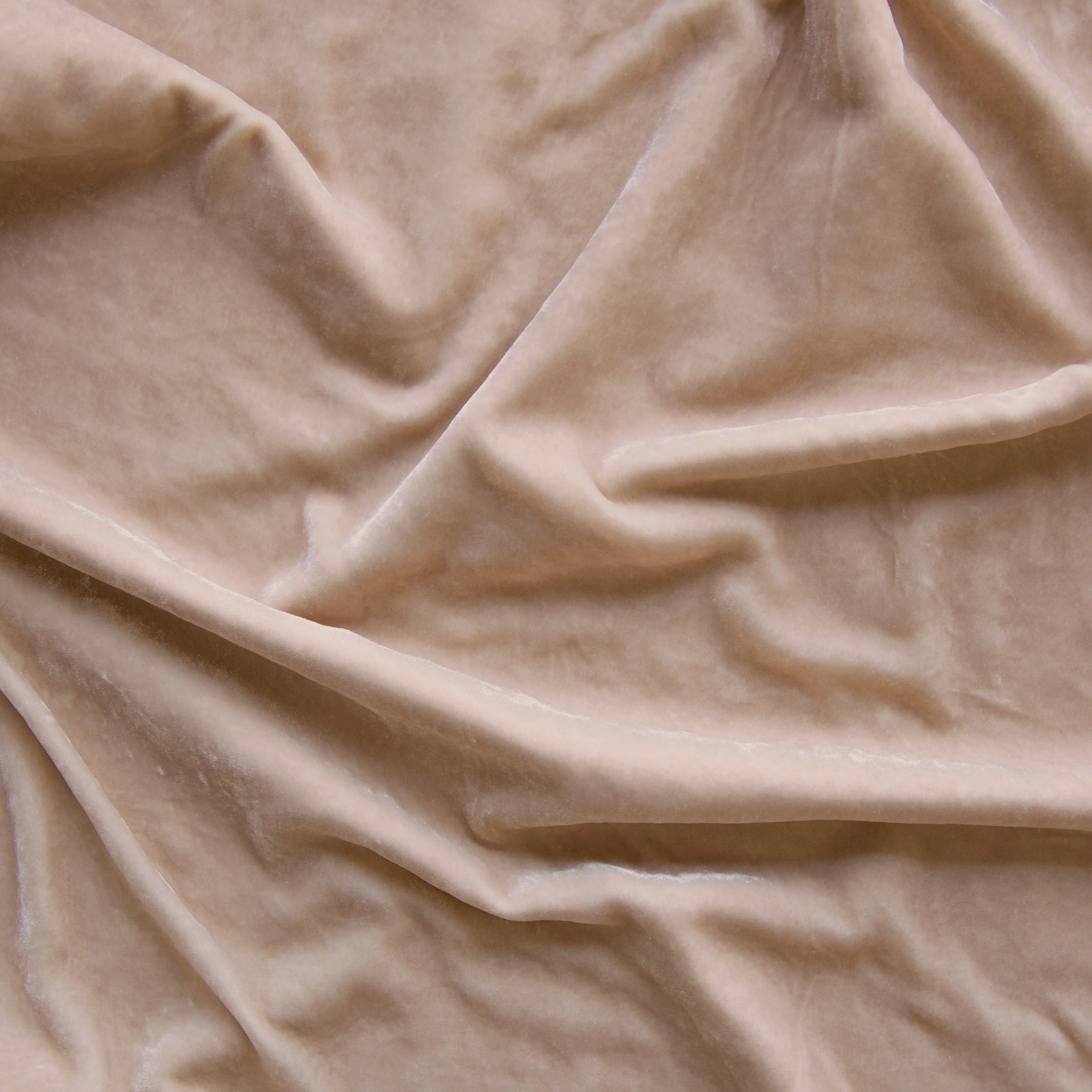 Pearl: A close up of silk velvet in pearl, a nude-like, soft rose pink tone. 