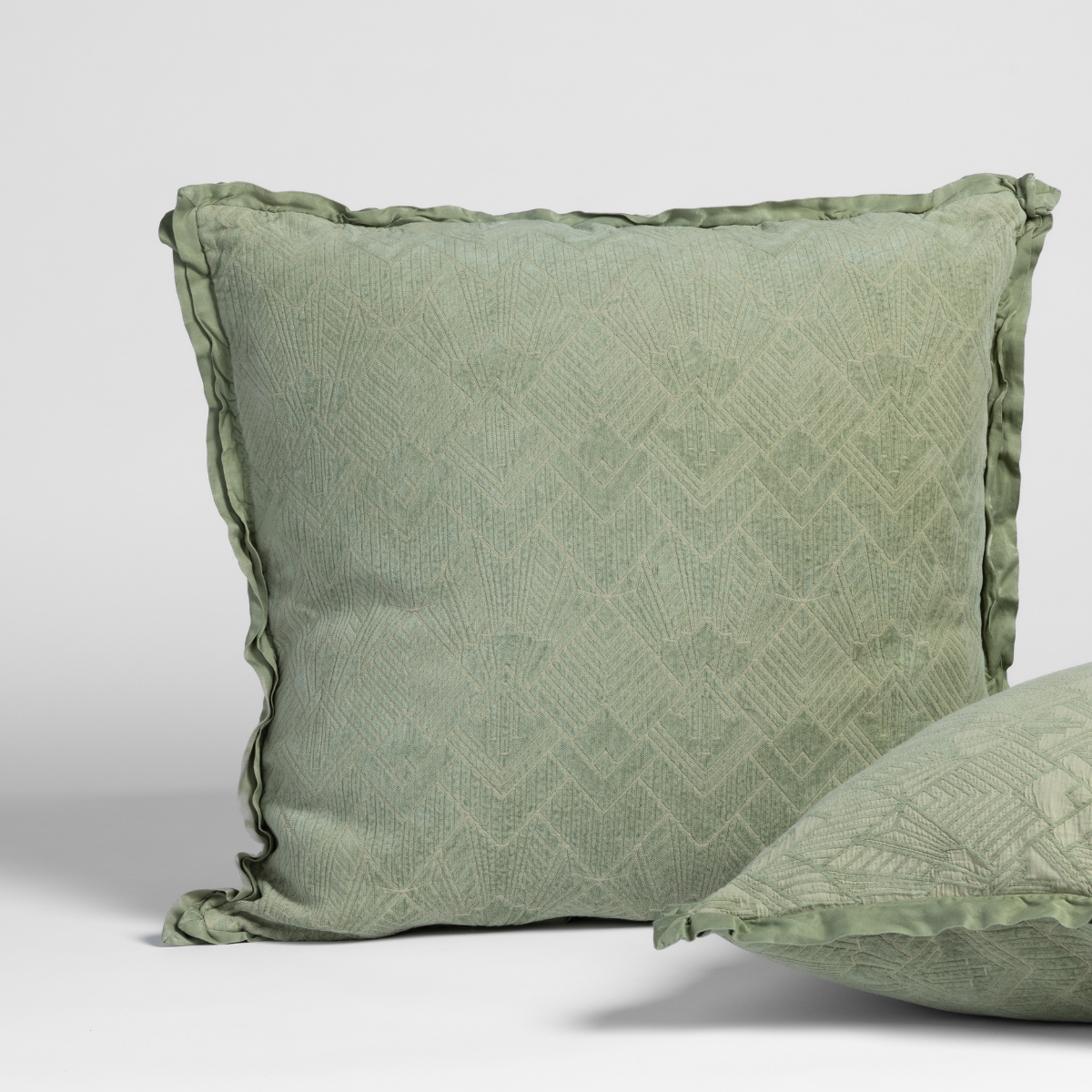 Desert Sage: matching shams in desert sage, a serenely elegant green, offering a hushed hue, shown against a plain background.