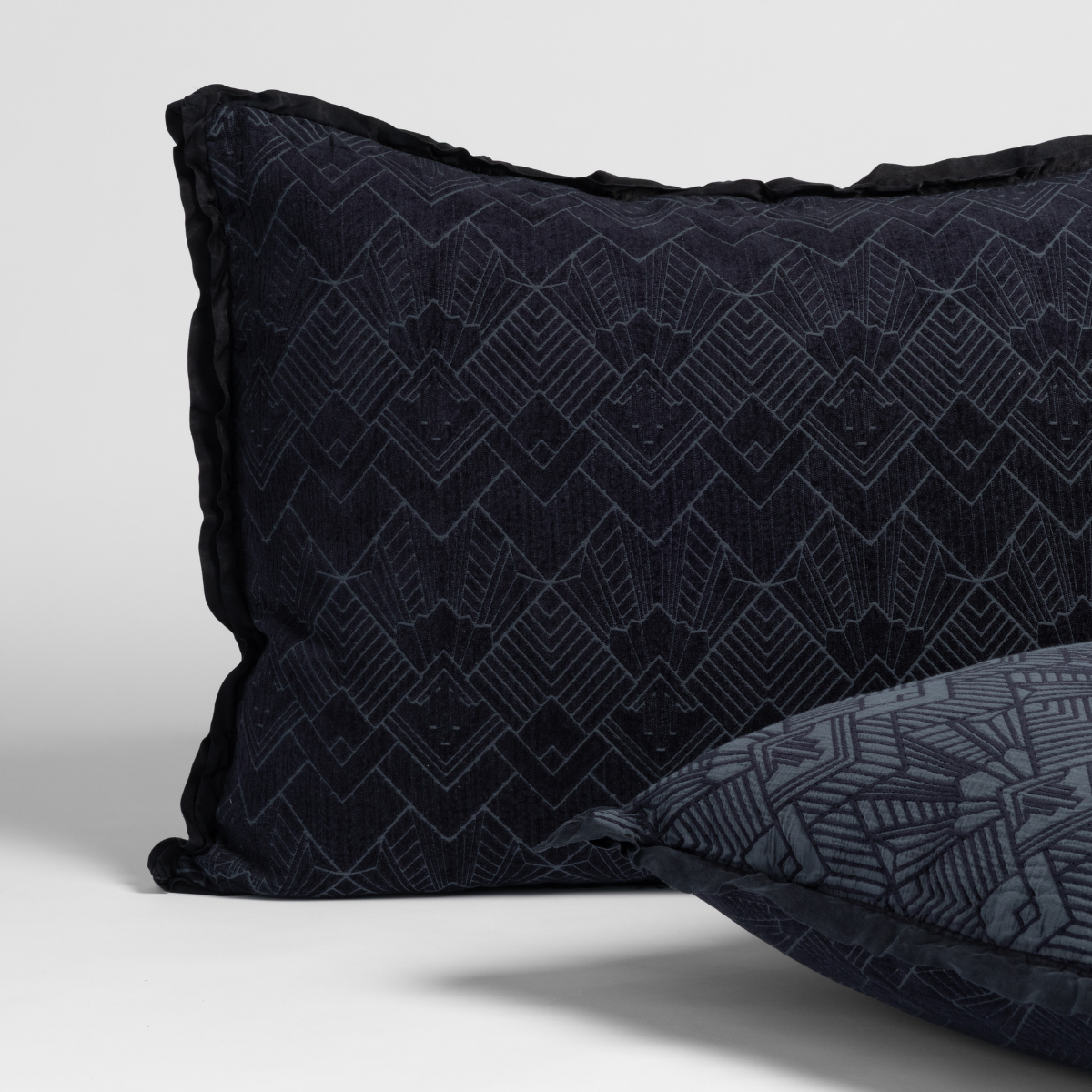 Slate: matching pair of tretino shams in slate, a polished dusky dark blue, shown against a white background.