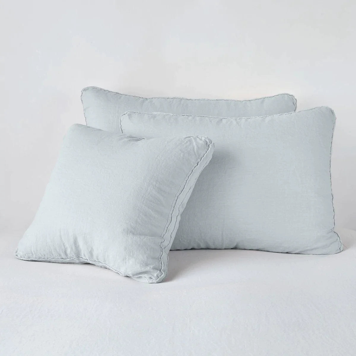 Cloud: Midweight linen shams in cloud colorway shown leaning upright on white background.