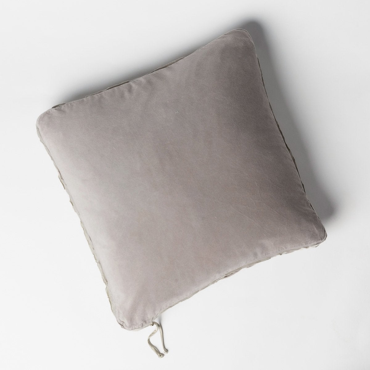 Fog: Cotton velvet 24 by 24 pillow on a plain background - overhead view.