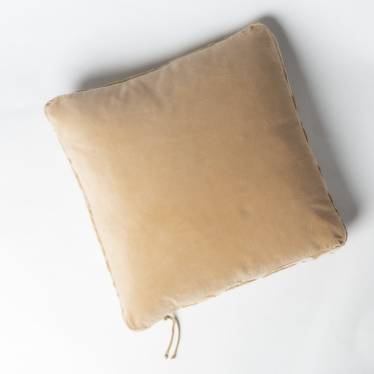Honeycomb: Cotton velvet 24 by 24 pillow on a plain background - overhead view.
