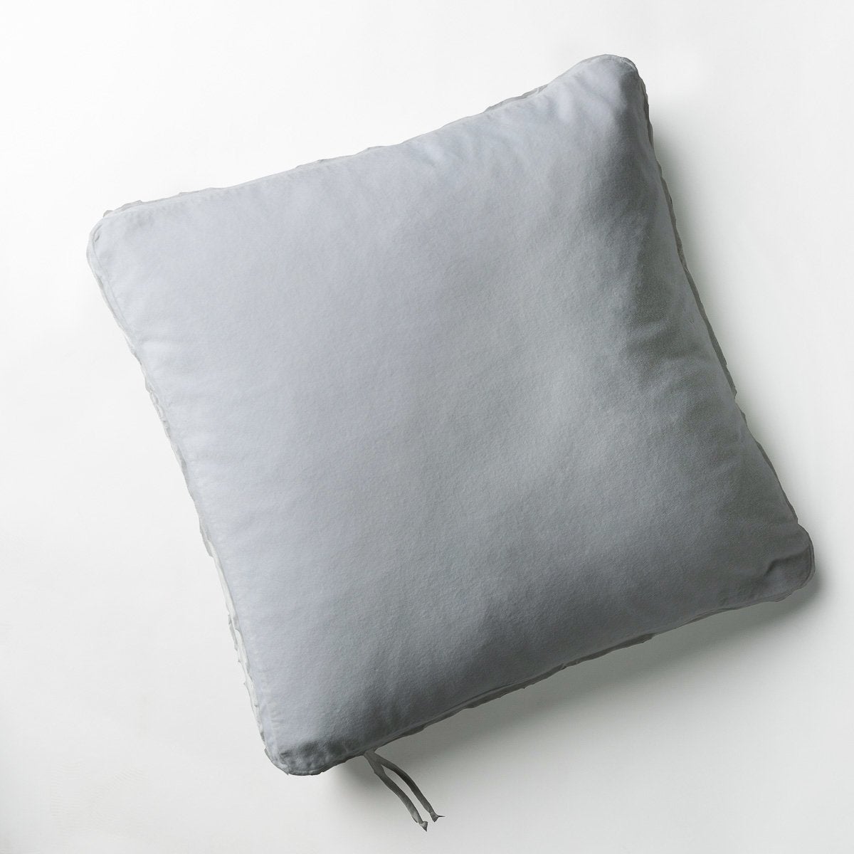 Mineral: Cotton velvet 24 by 24 pillow on a plain background - overhead view.