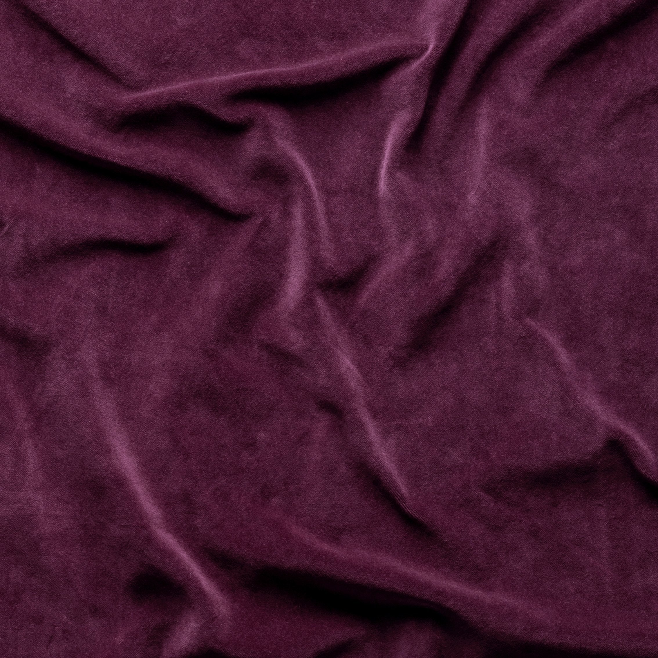 Fig: A close up of cotton velvet in fig, a richly saturated purple-garnet. 