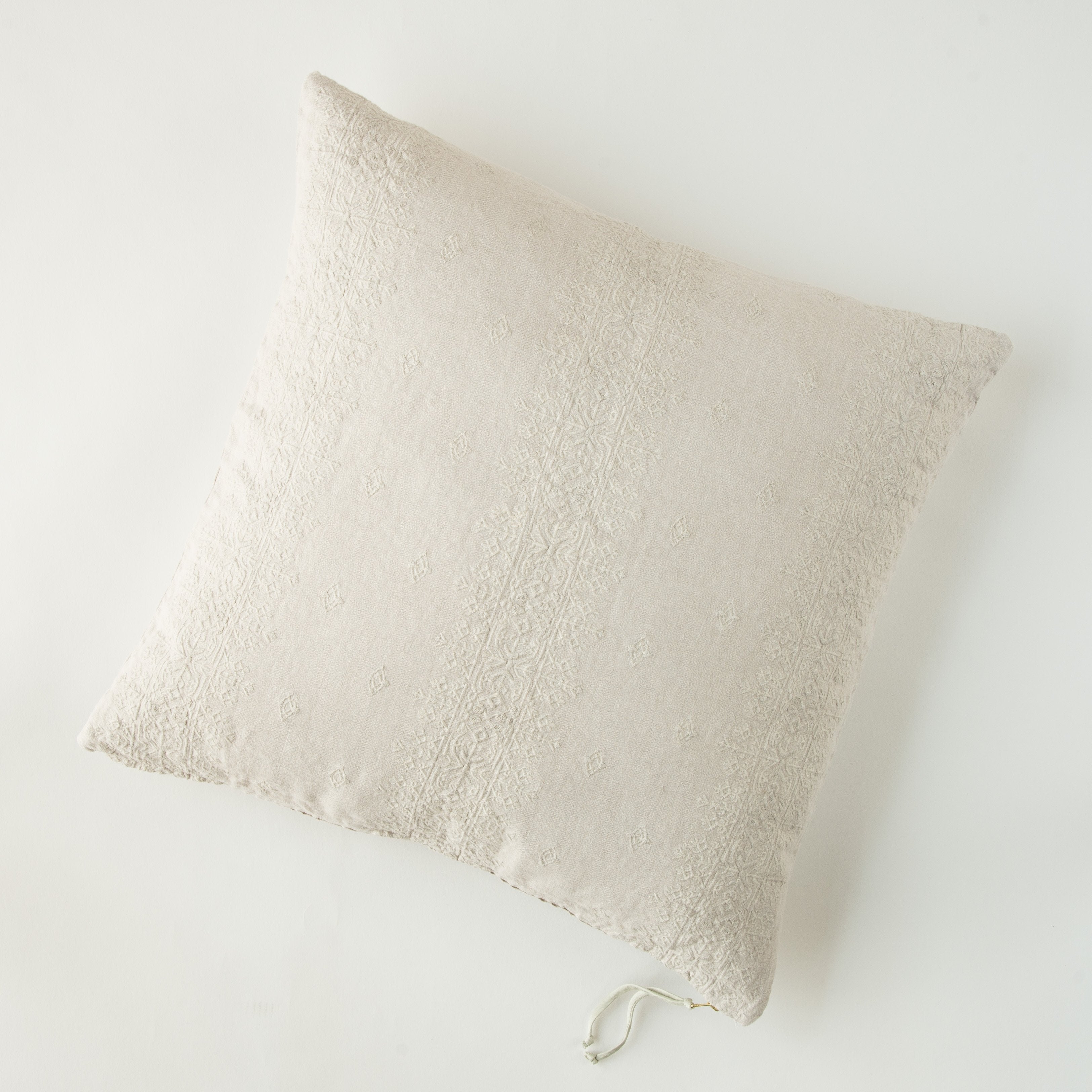 Parchment: pillow on a white background - overhead view.