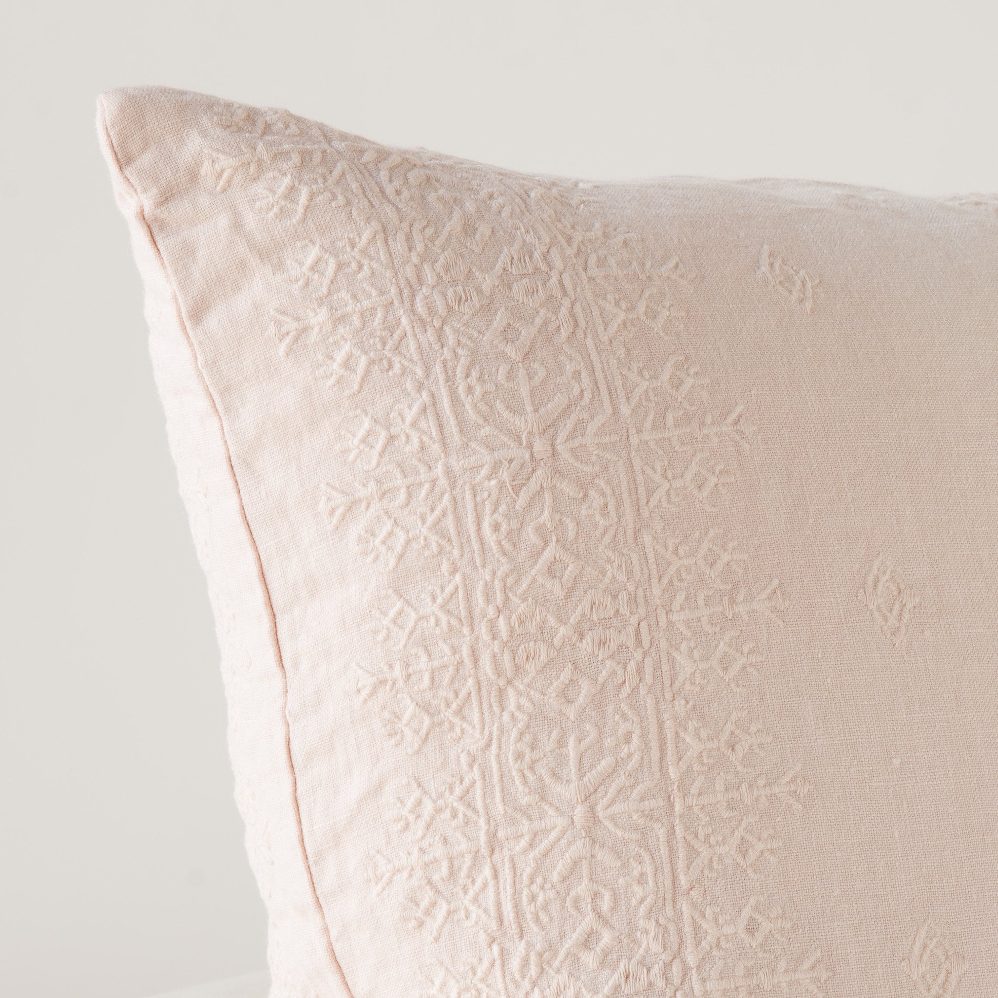 Pearl: Close-up of pillow corner, showcasing the embroidery pattern detail.