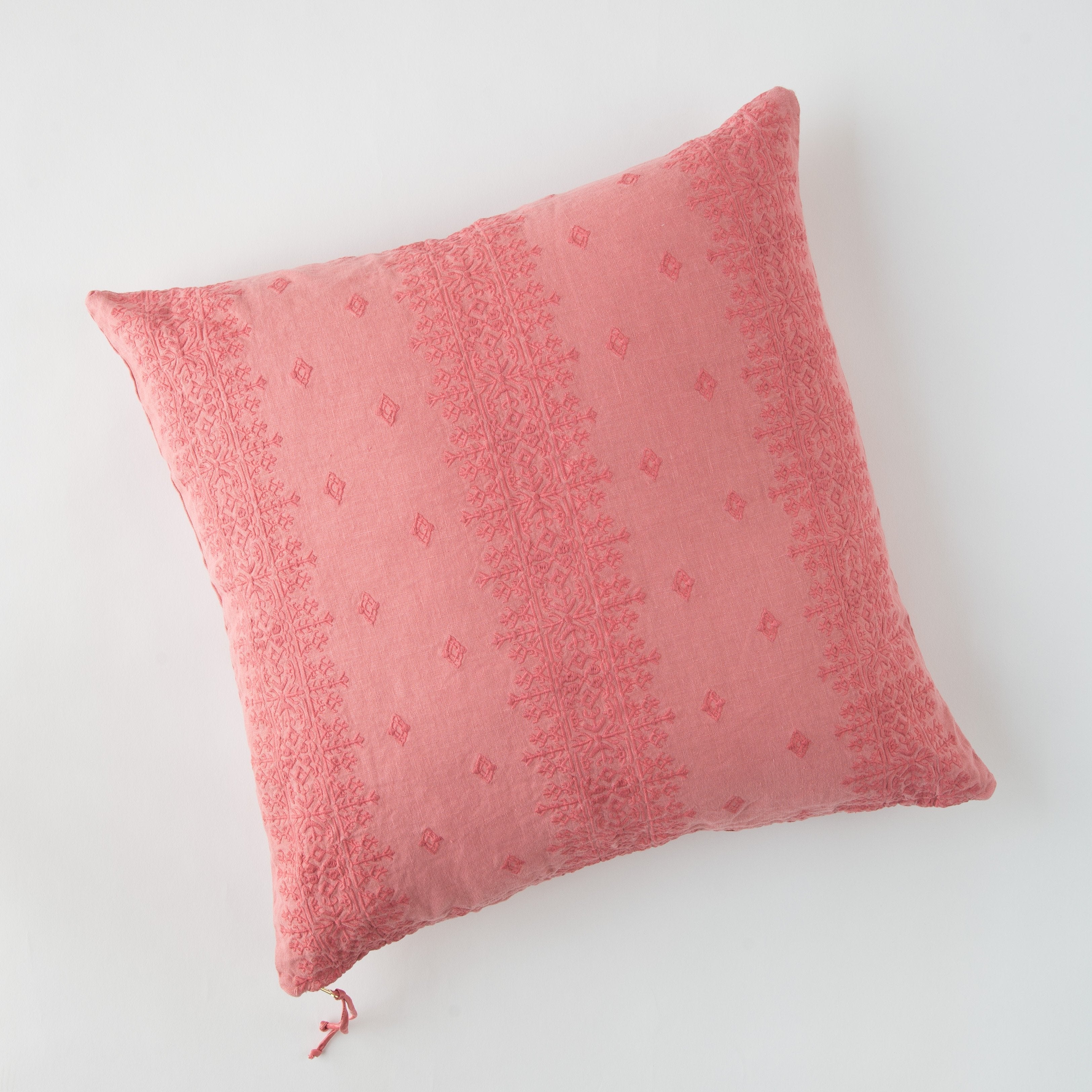 Poppy: pillow on a white background - overhead view.
