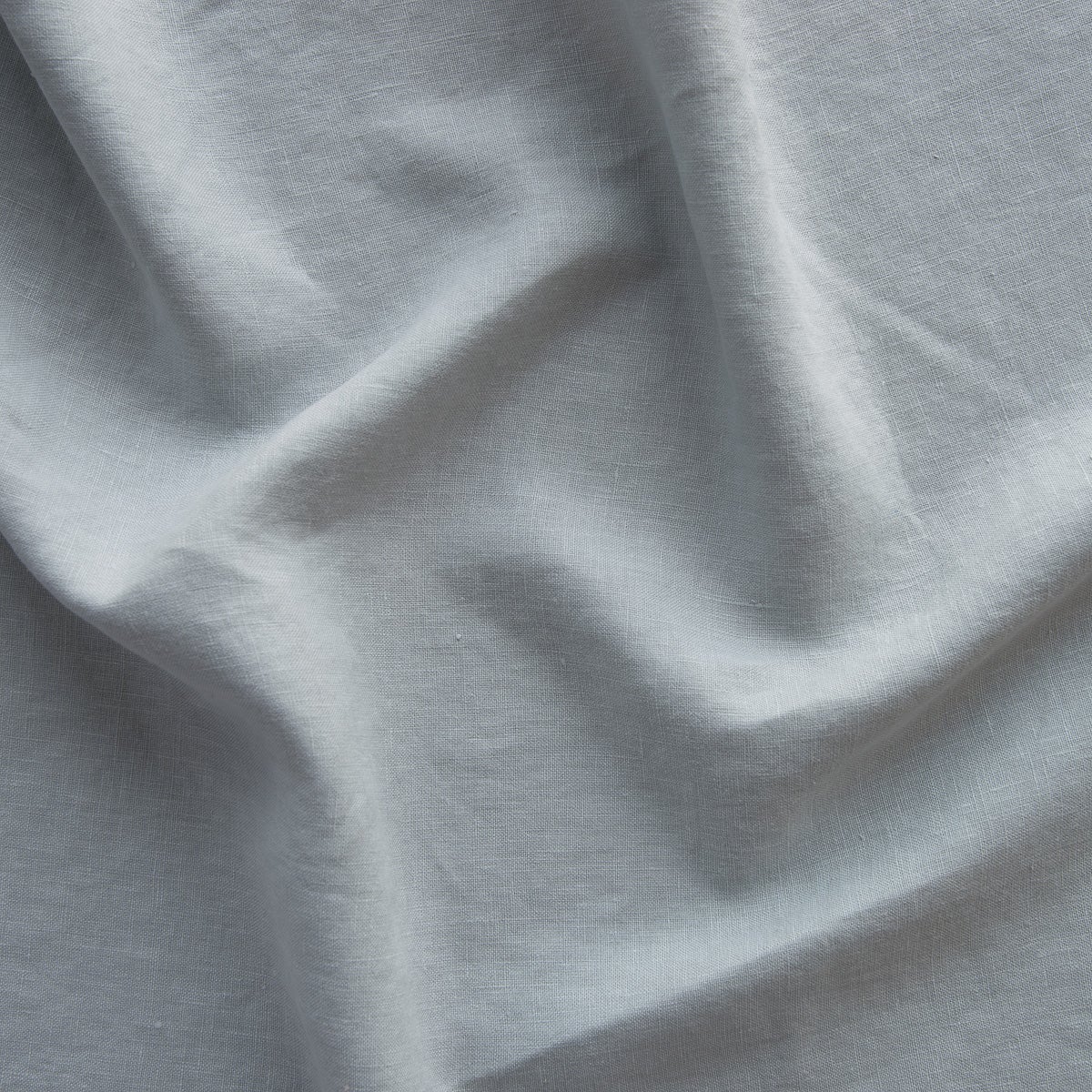 Mineral: A close up of linen in mineral, a soothing seafoam blue with subtle grey-green undertones. 