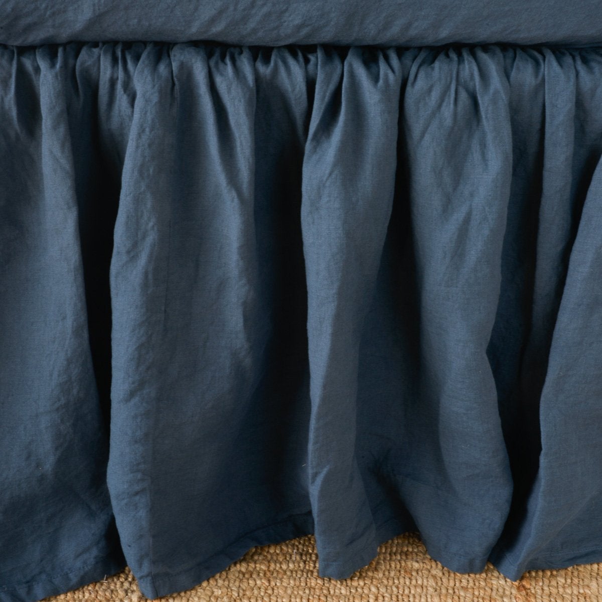 Midnight: Close-up of bed skirt, featuring its softly gathered design.