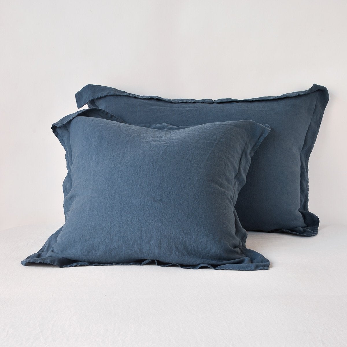 Midnight: Two shams leaning upright against a white background.